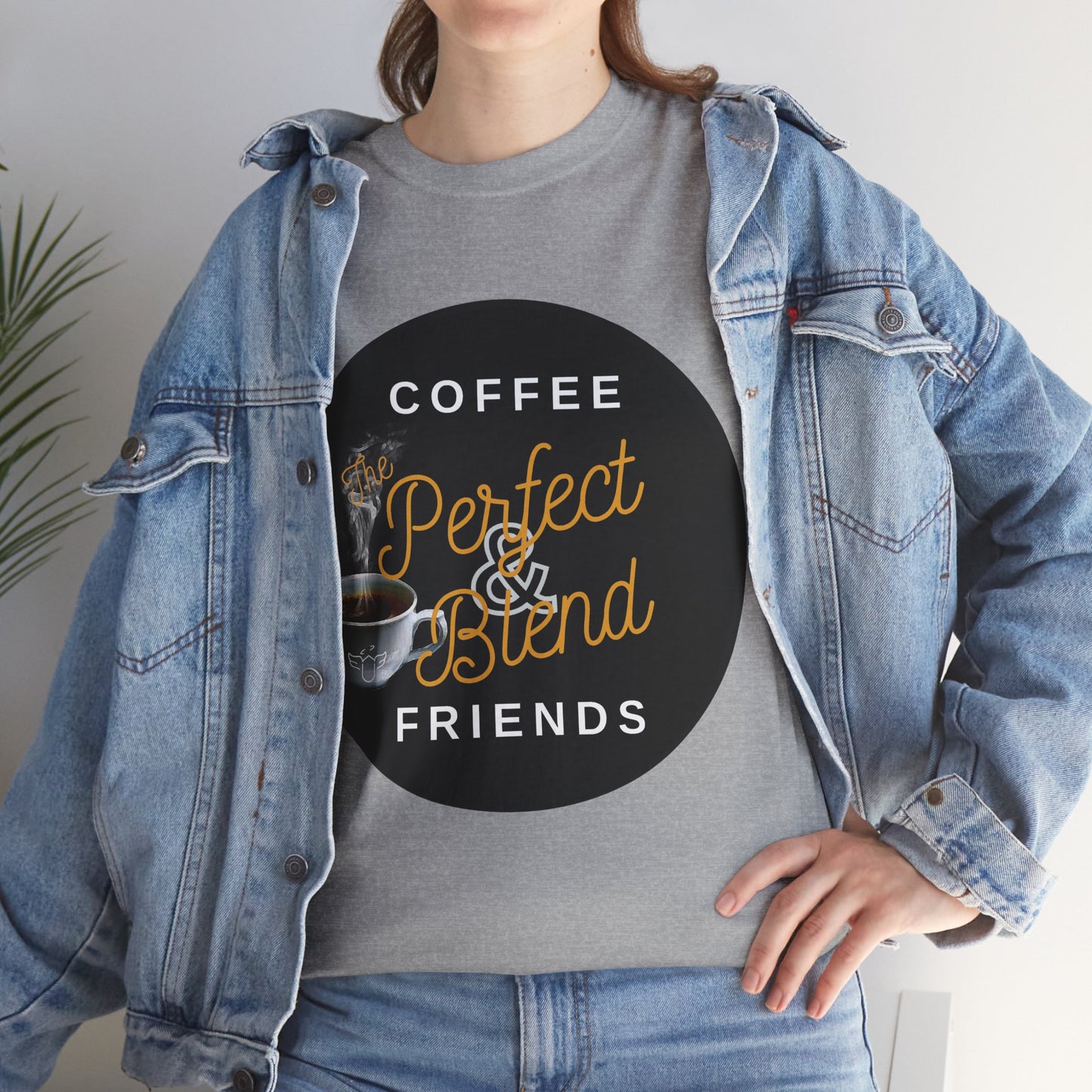 Coffee Lovers Cotton T-shirt, Person wearing a gray t-shirt with a coffee-themed design and denim jacket.