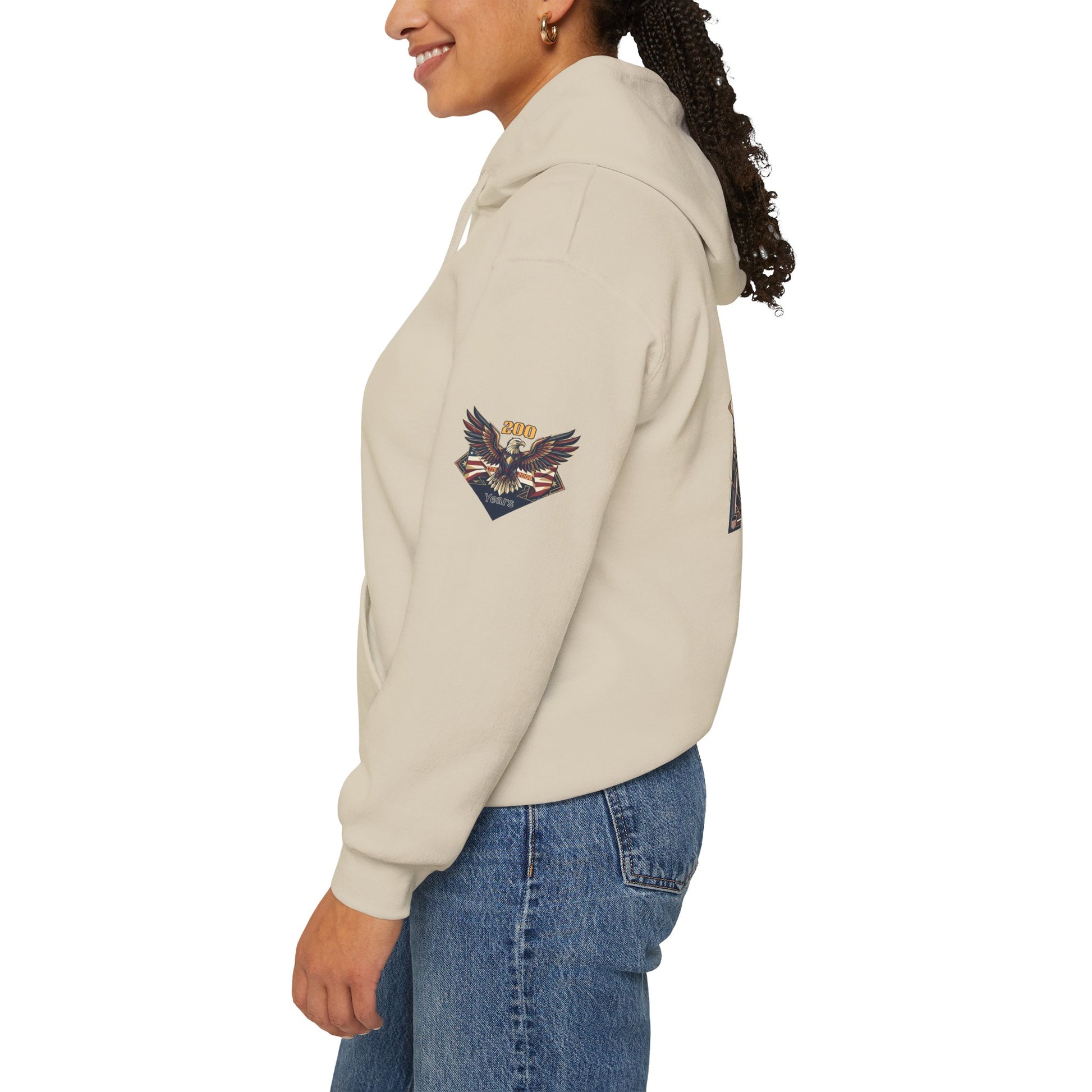 America 250 Years of Freedom Hoodie — USA 250th ANNIVERSARY Patriotic Hoodie, Person wearing a beige hoodie with brand logos on a white background