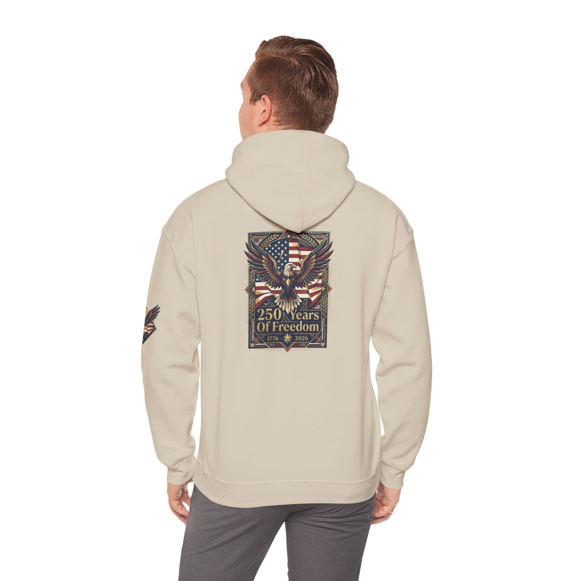 America 250 Years of Freedom Hoodie — USA 250th ANNIVERSARY Patriotic Hoodie, Person wearing a beige hoodie with a colorful design on the back, standing against a white background