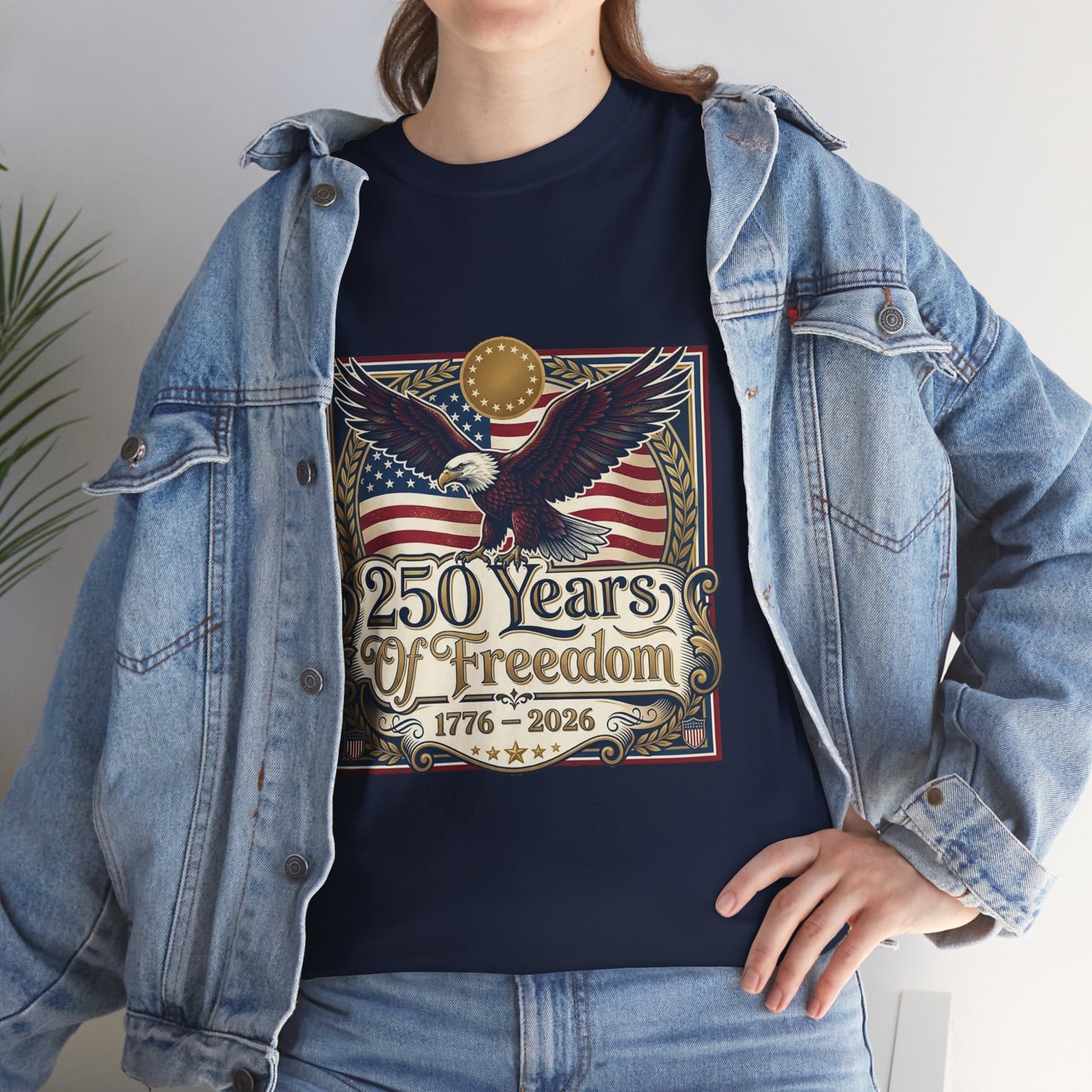 250 Years of Freedom T-Shirt — USA 250TH Anniversary Patriotic Eagle Tee, Person wearing a navy blue t-shirt with an eagle and American flag design, standing against a neutral background.