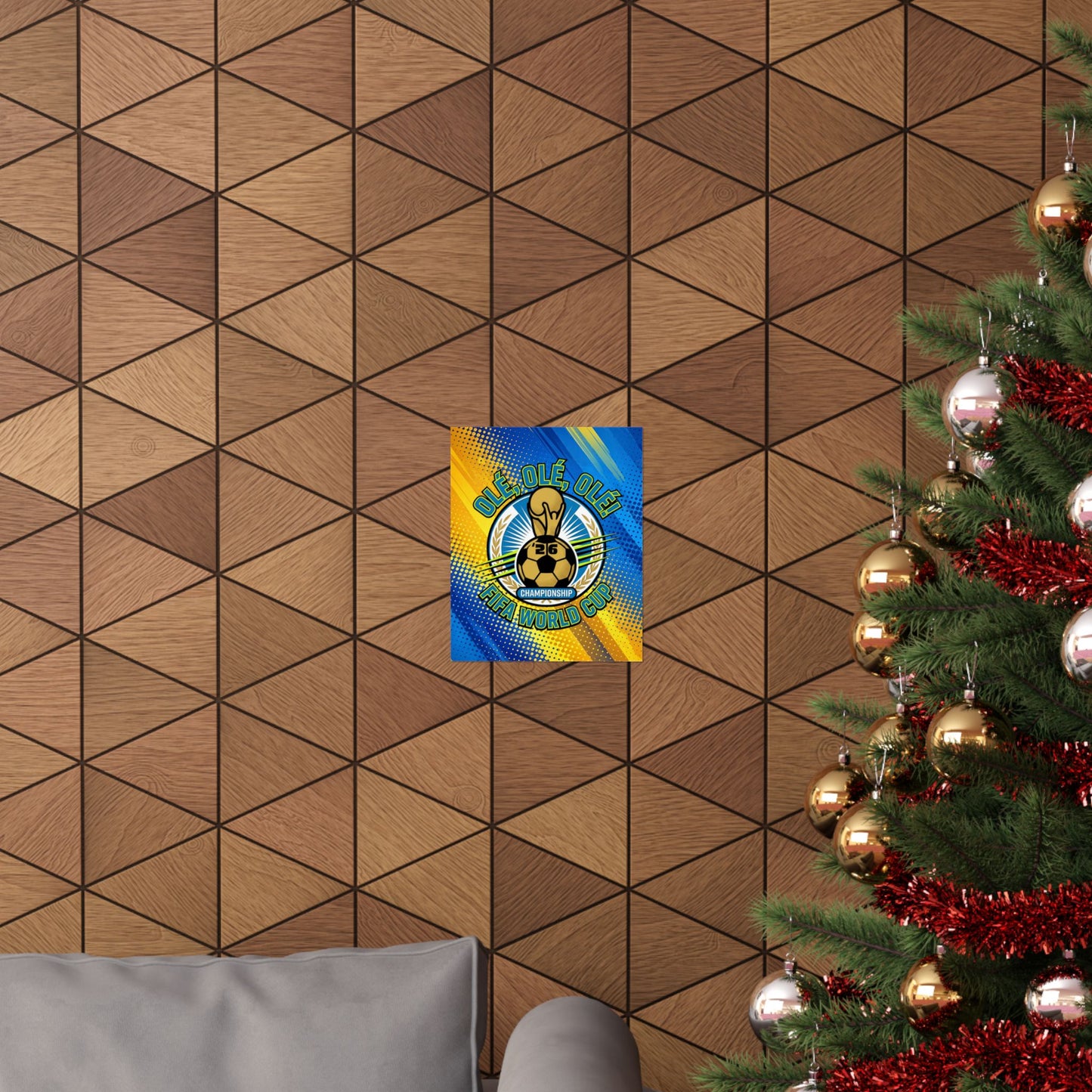 Decorative wall tile with a colorful graphic on a geometric patterned wall next to a Christmas tree.