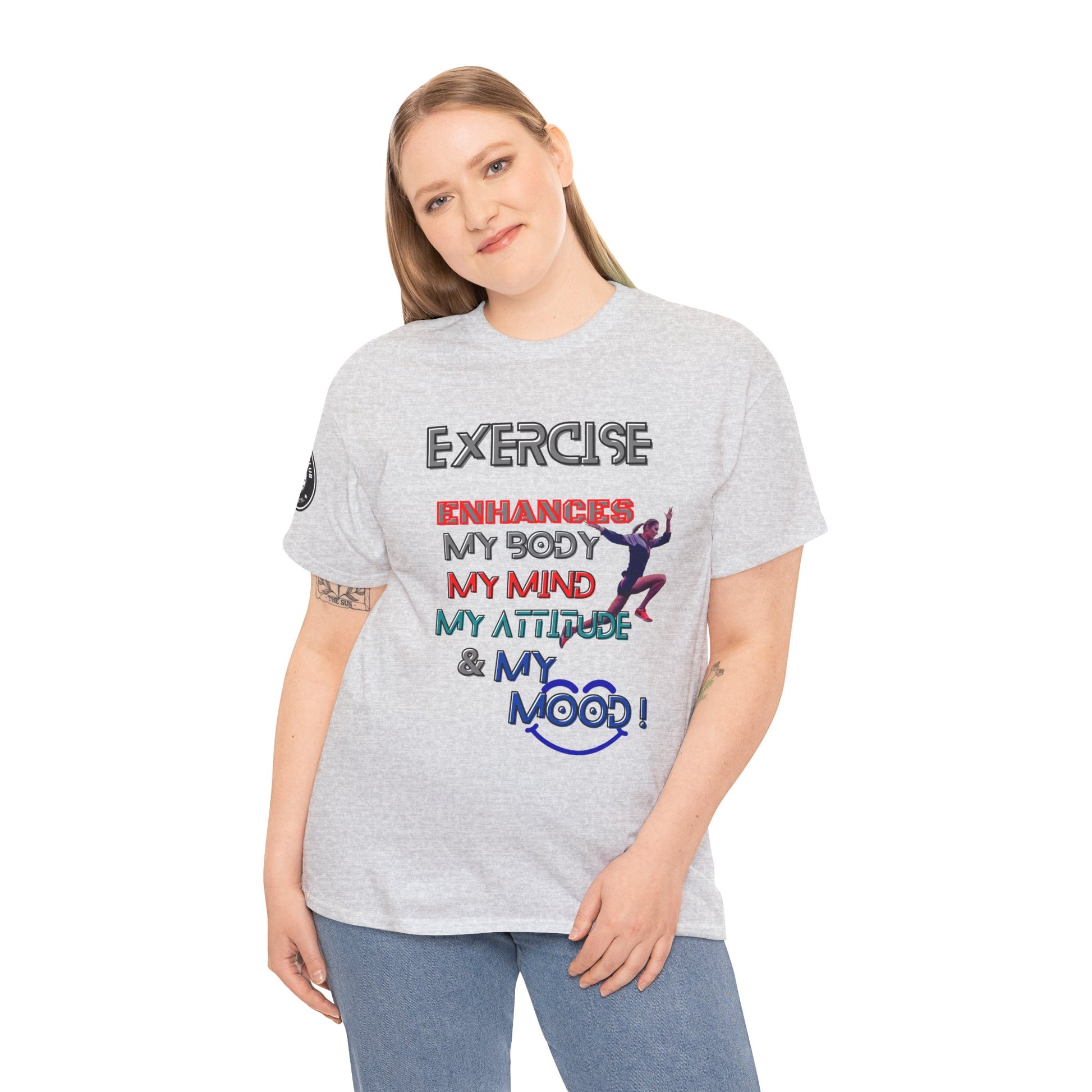 Fitness Quotes Gym Heavy Cotton Tee - Exercise enhances My Body T-shirt. Person wearing a gray t-shirt with colorful text and graphics on a white background