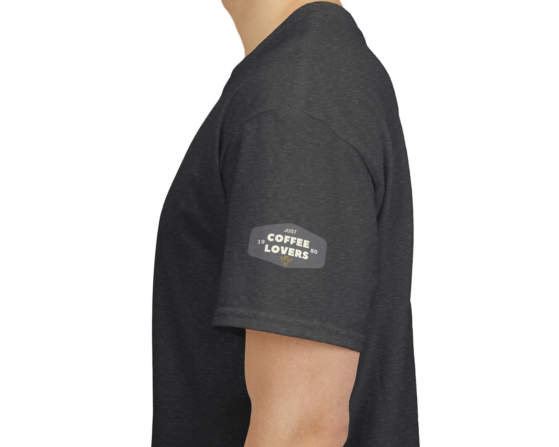 Coffee Lovers Cotton Tee - 'Better Late than Never', Person wearing a dark gray t-shirt with 'Coffee Lovers' text on a white background