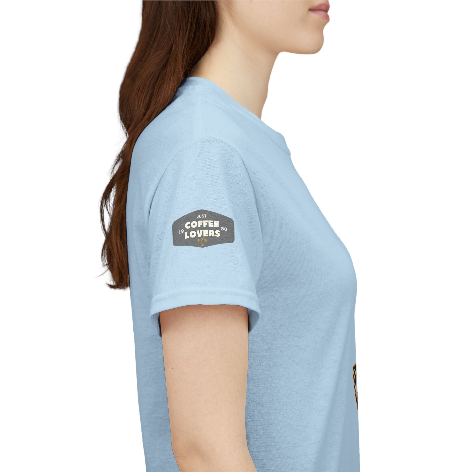 Coffee Lovers Tee with Quote - 'Love is in the Air Ah.. the Aroma of Coffee',  Light blue t-shirt with a logo on the sleeve worn by a person