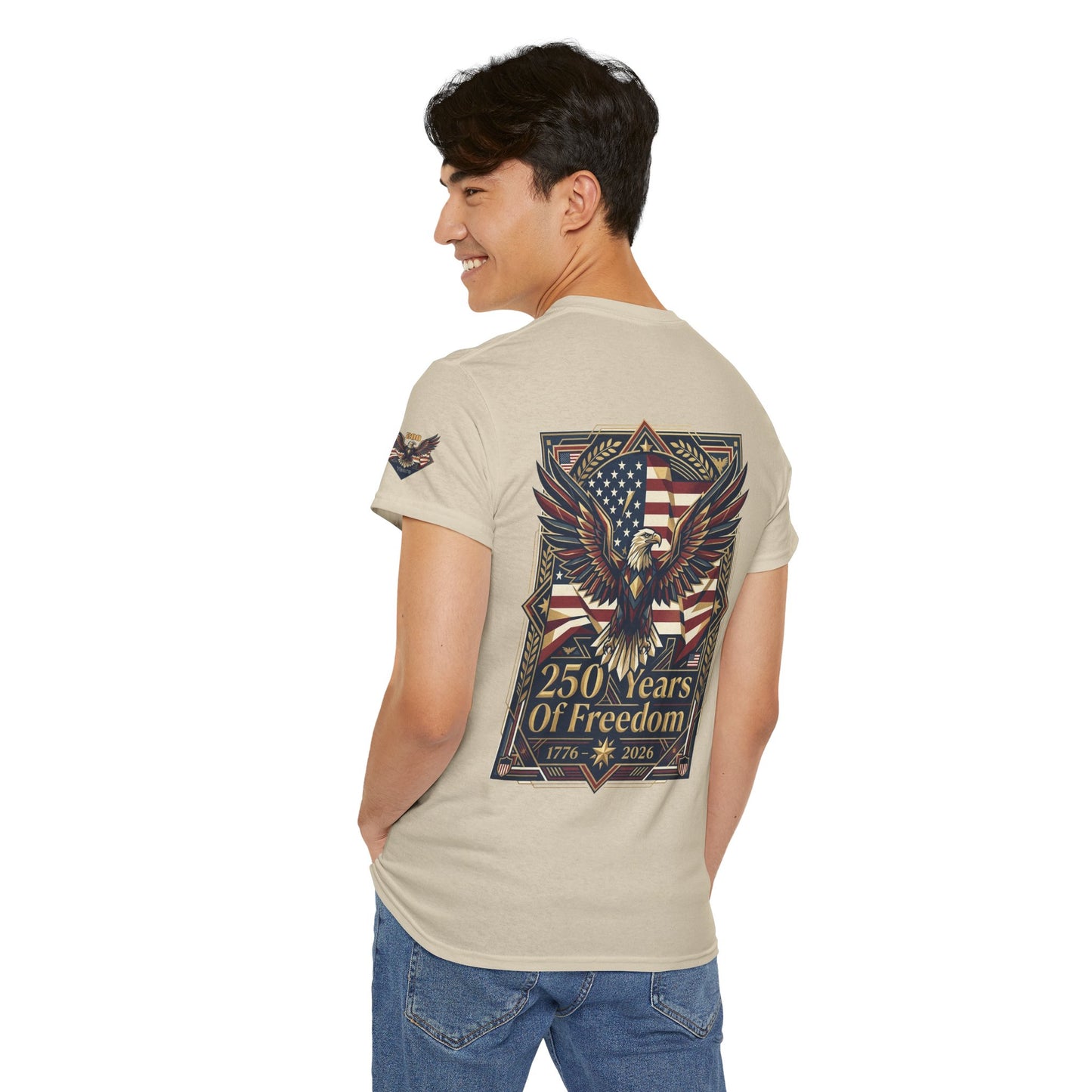 250 Years of Freedom Eagle T-Shirt, Man wearing a beige t-shirt with an eagle and American flag design on the back, on a white background.