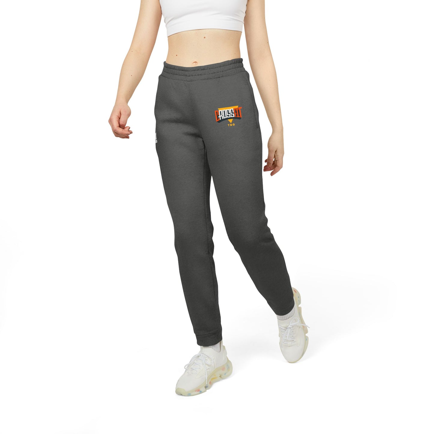 Adidas Sports Fleece Joggers for CrossFit Enthusiasts, Person wearing gray sweatpants with a logo on a white background
