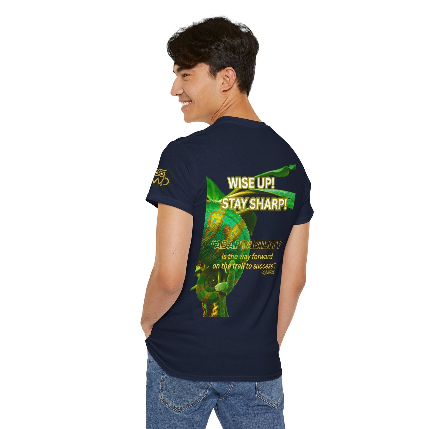 Wise Up Adapt! Motivational T-shirt — 'Wise Up! Stay Sharp!' Graphic Novelty Tee, Person wearing a navy blue t-shirt with green graphics and text on the back, standing against a white background.