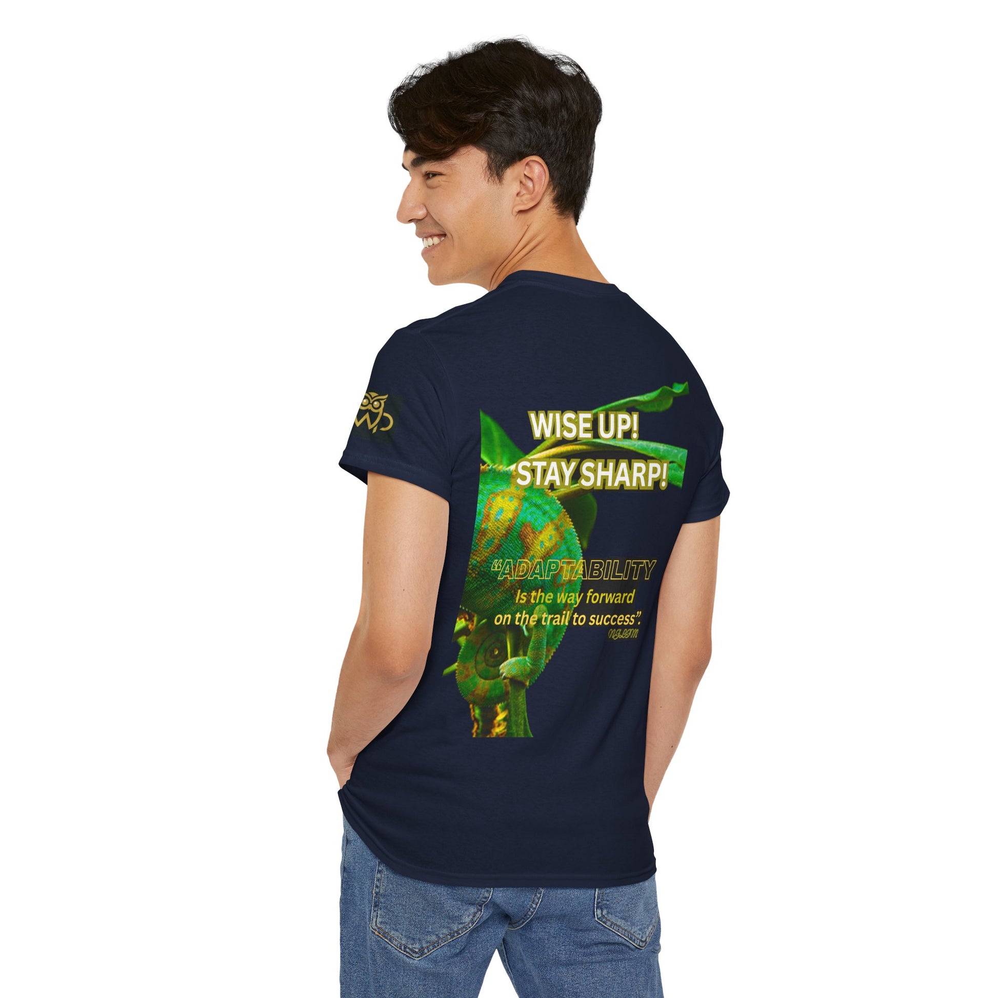 Wise Up Adapt! Motivational T-shirt — 'Wise Up! Stay Sharp!' Graphic Novelty Tee, Person wearing a navy blue t-shirt with green graphics and text on the back, standing against a white background.