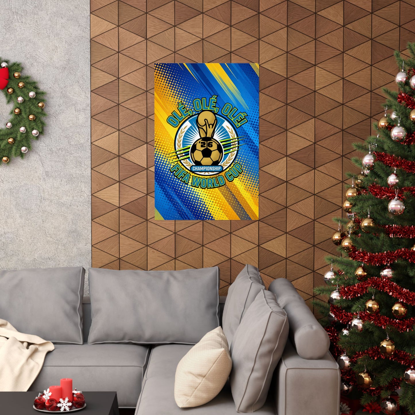 Decorative banner with a logo on a wall above a gray sofa with Christmas trees on either side.