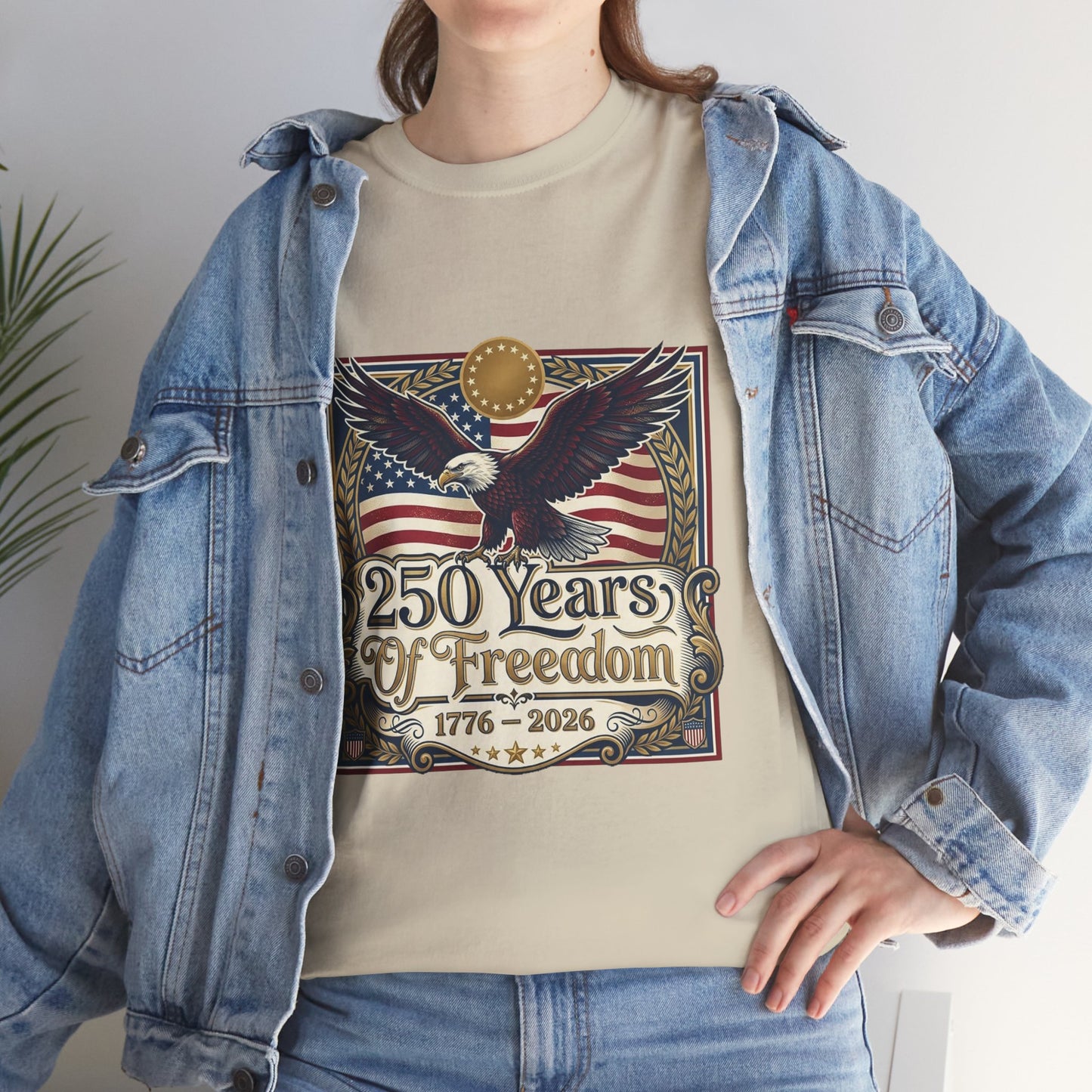 250 Years of Freedom T-Shirt — USA 250TH Anniversary Patriotic Eagle Tee, Person wearing a t-shirt with an eagle and American flag design, standing indoors.