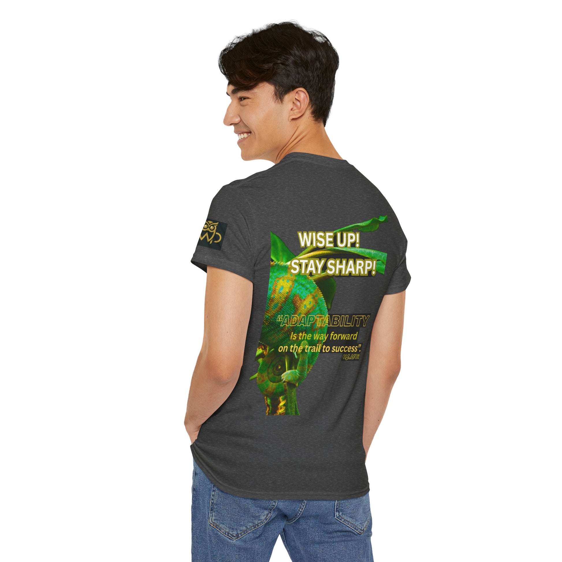 Wise Up Adapt! Motivational T-shirt — 'Wise Up! Stay Sharp!' Graphic Novelty Tee, Person wearing a dark gray t-shirt with green and yellow graphics and text on the back.