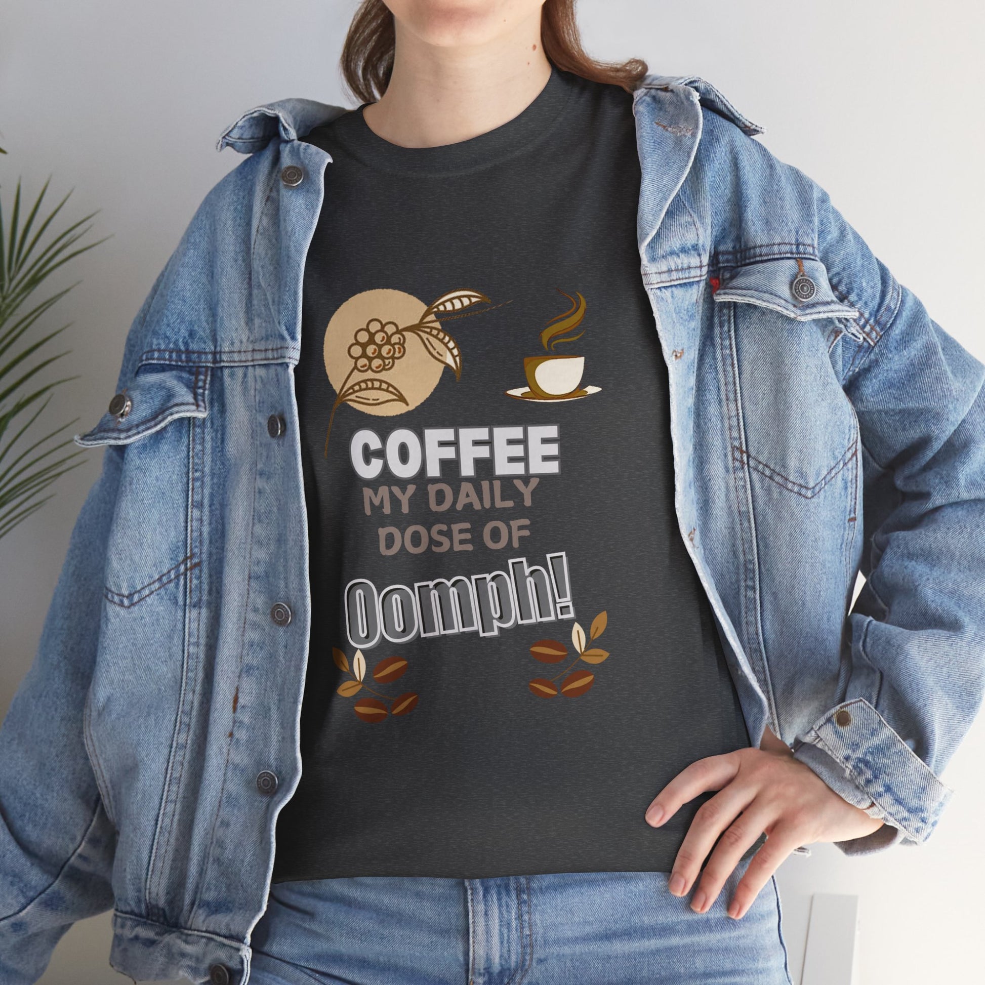 Coffee Lovers Heavy Cotton Tee - My Daily Dose of Oomph! Person wearing a black t-shirt with coffee-themed design and denim jacket.