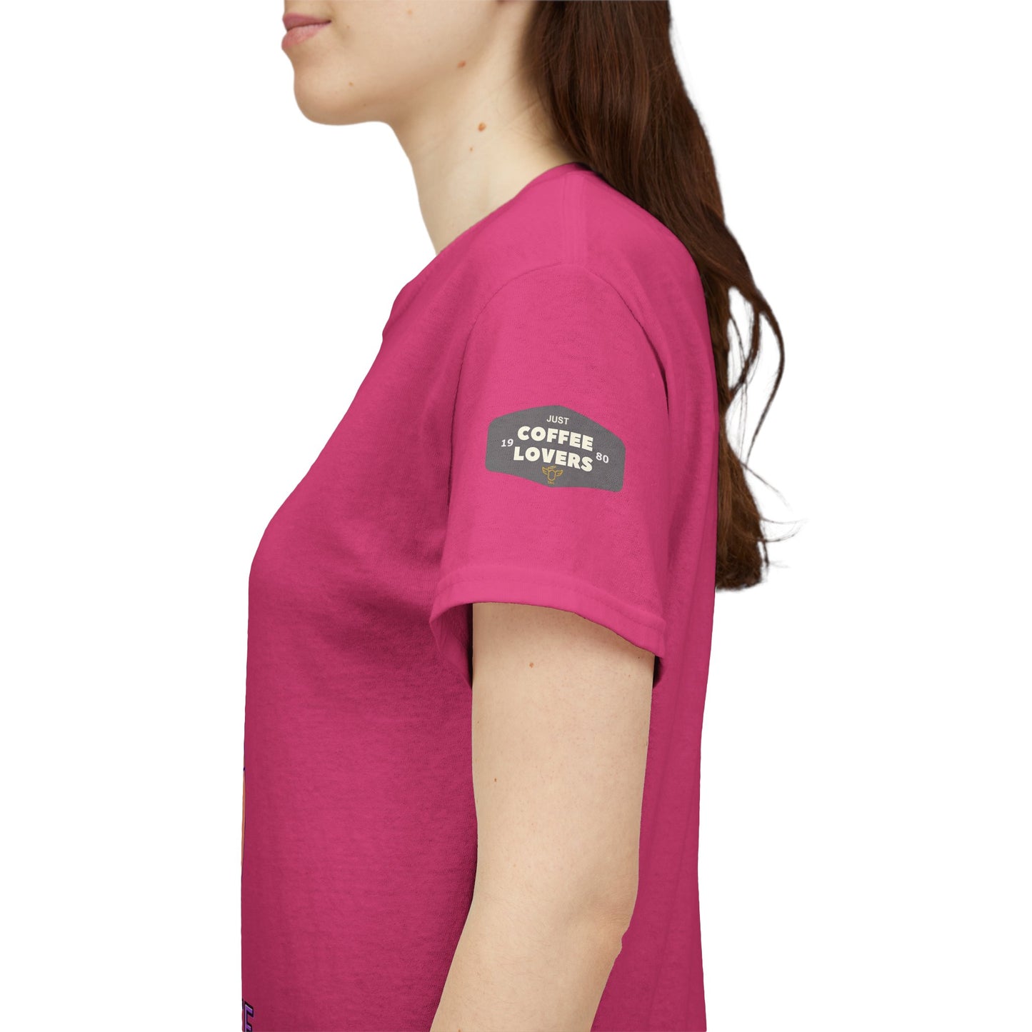 COFFEE LOVERS' T-SHIRT, Person wearing a pink t-shirt with a logo on the sleeve against a white background