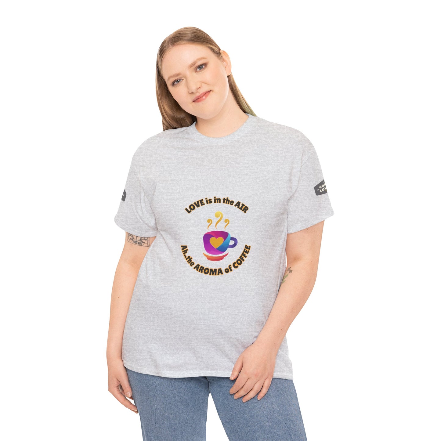 Coffee Lovers Tee with Quote - 'Love is in the Air Ah.. the Aroma of Coffee',  Person wearing a gray t-shirt with a colorful graphic and text on a white background