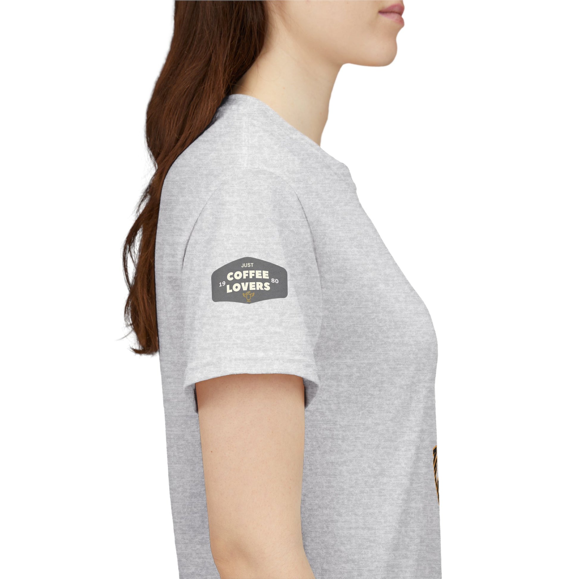 Coffee Lovers Tee with Quote - 'Love is in the Air Ah.. the Aroma of Coffee',  Person wearing a gray t-shirt with a 'Coffee Lovers' patch on a white background