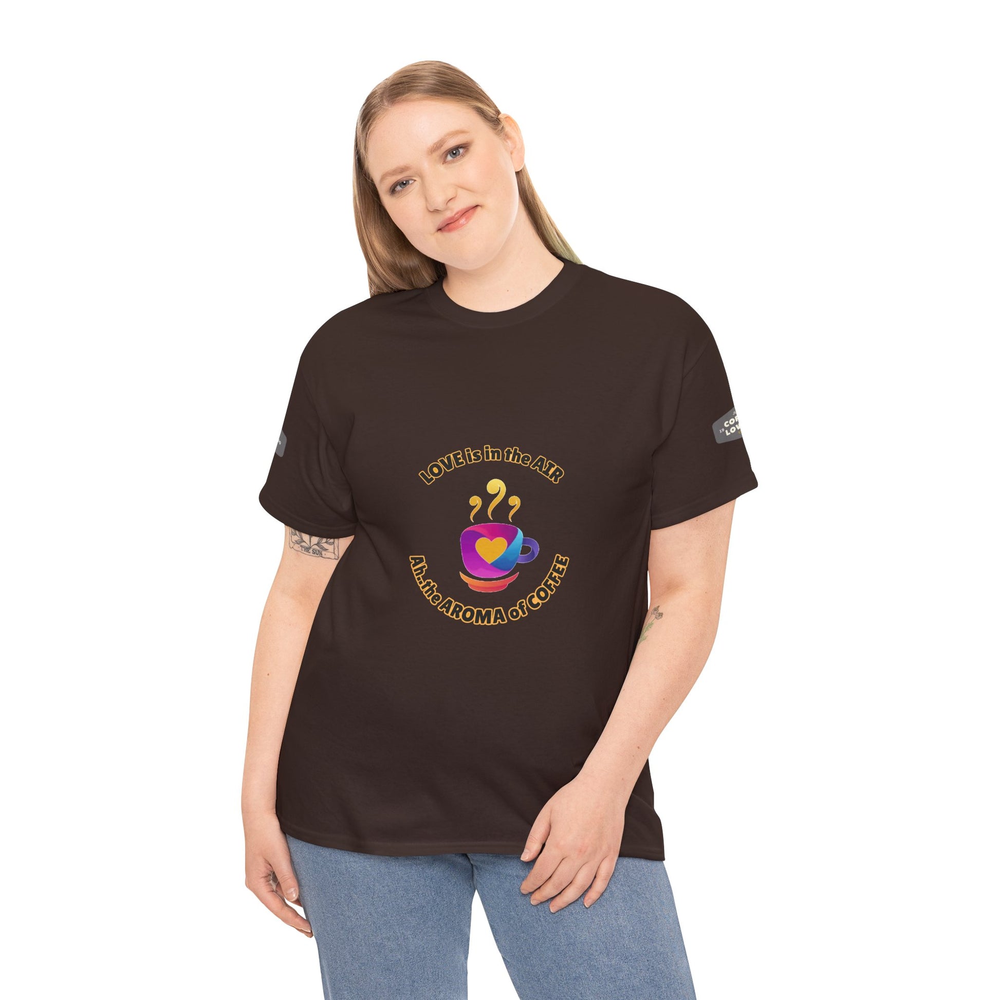 Coffee Lovers Tee with Quote - 'Love is in the Air Ah.. the Aroma of Coffee',  Person wearing a black t-shirt with a colorful graphic design on a white background