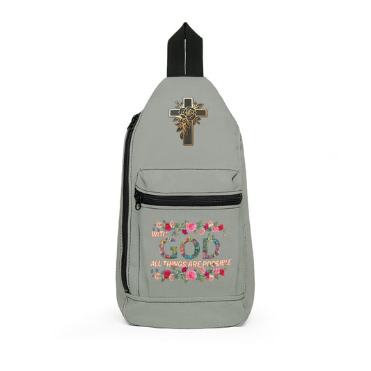 Gray sling bag with floral design and Christian motif on a white background