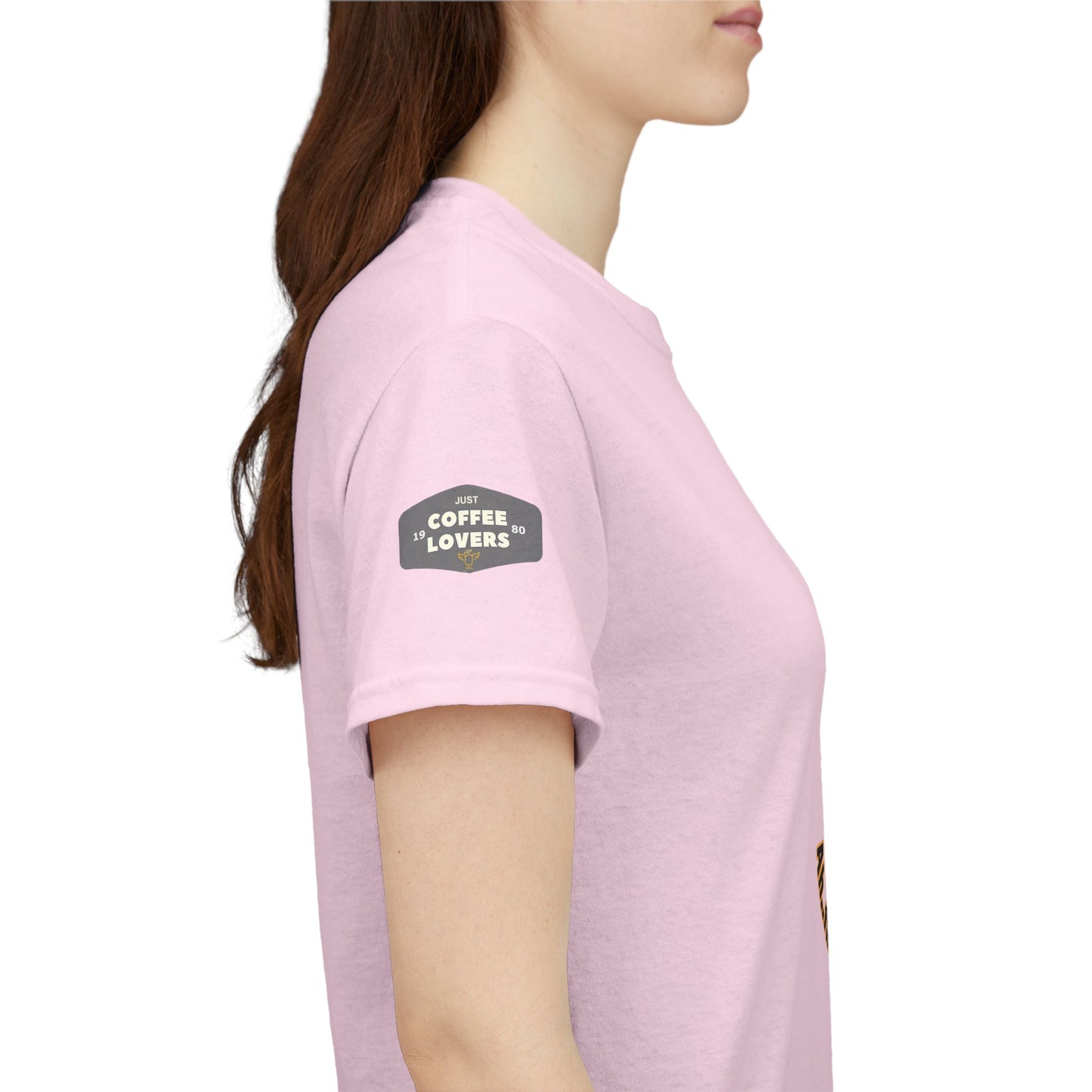 Coffee Lovers Tee with Quote - 'Love is in the Air Ah.. the Aroma of Coffee',  Person wearing a pink t-shirt with a logo on the sleeve against a white background
