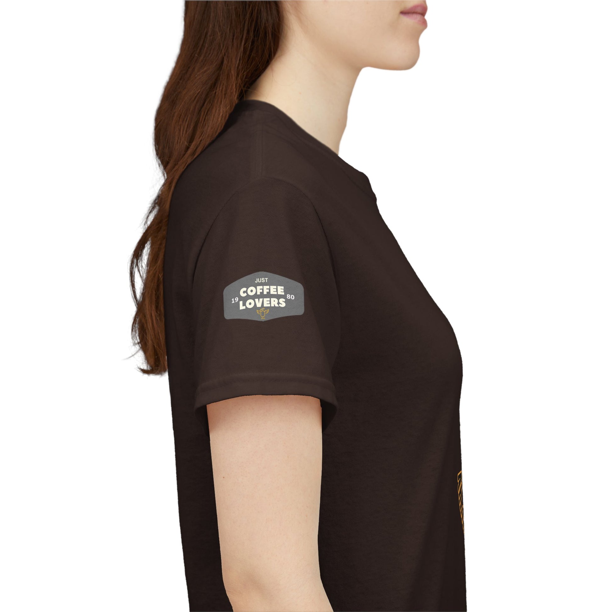 Coffee Lovers Tee with Quote - 'Love is in the Air Ah.. the Aroma of Coffee',  Person wearing a brown t-shirt with a logo on the sleeve against a white background