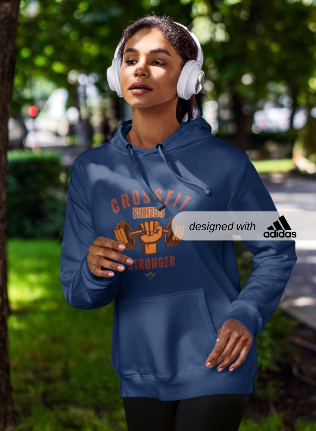 Adidas Sport Fleece Hoodie for CrossFit Warriors, Adidas Sports Hoodies, Person wearing a blue hoodie with a visible Adidas logo outdoors.