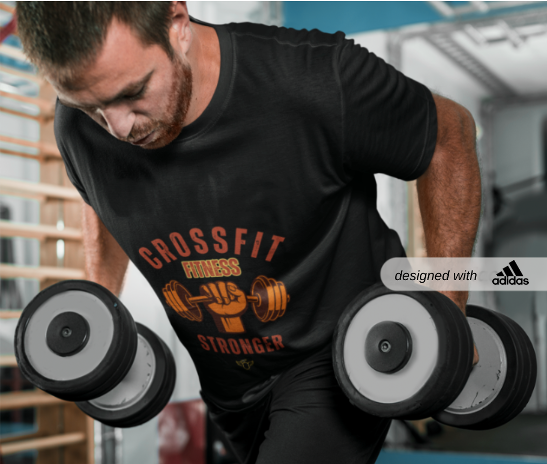 Adidas Sport T-shirt for  CrossFit Enthusiasts, Adidas CrossFit T-shirt, Man lifting dumbbells wearing a black 'CrossFit Fitness Stronger' t-shirt with Adidas logo.