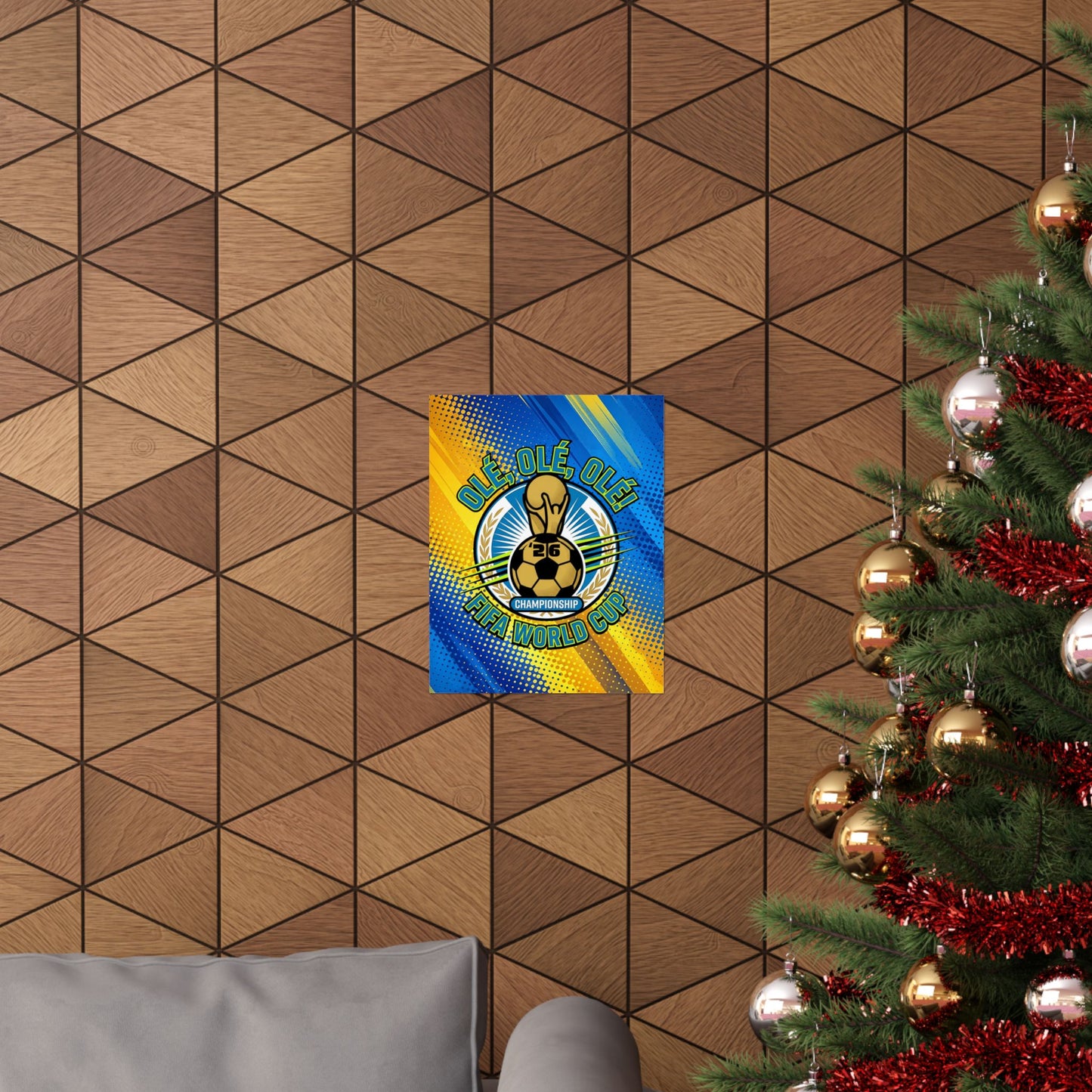 Decorative poster with a logo on a geometric-patterned wall next to a Christmas tree.