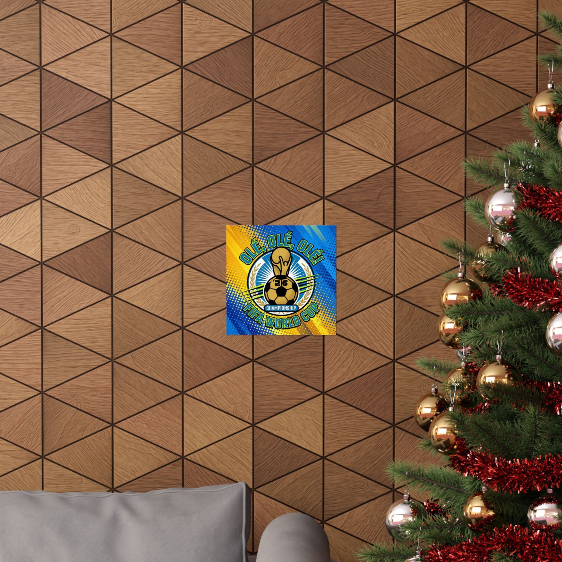 Decorative wall art with a gold mask on a geometric brown wall next to a Christmas tree.