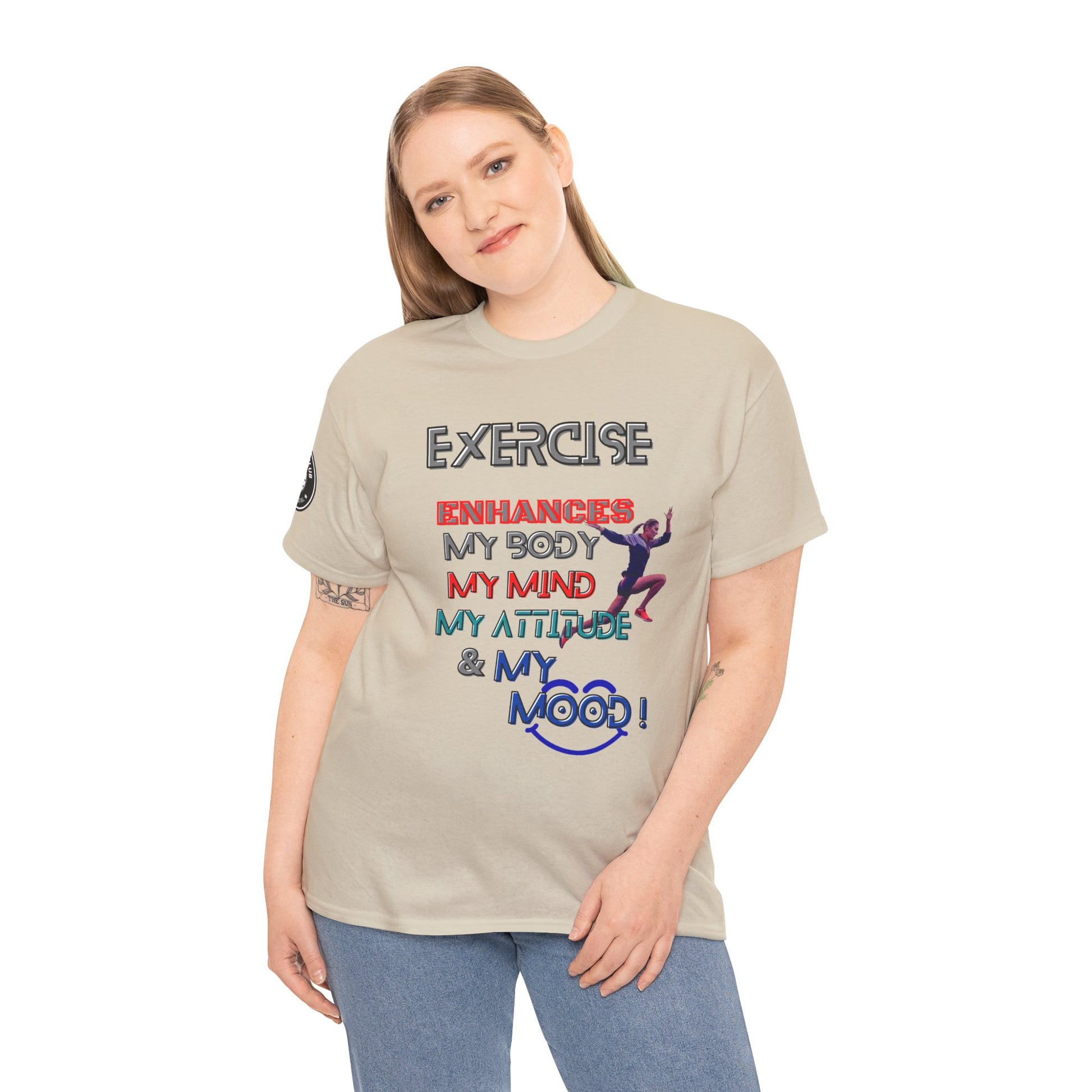Fitness Quotes Gym Heavy Cotton Tee - Exercise enhances My Body T-shirt. Woman wearing a beige t-shirt with motivational text design on a white background