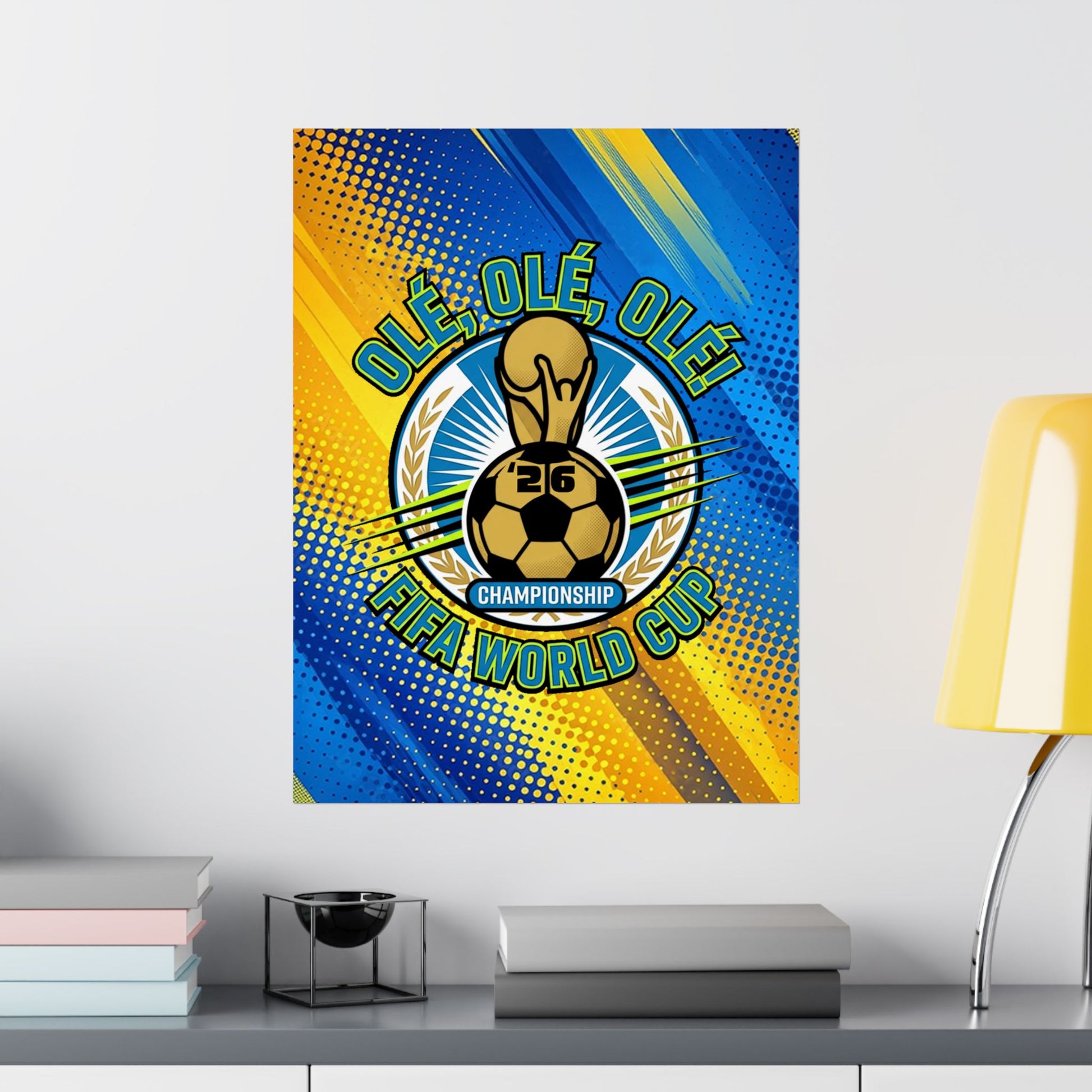 FIFA World Cup championship poster on a wall with books and a lamp in the foreground.