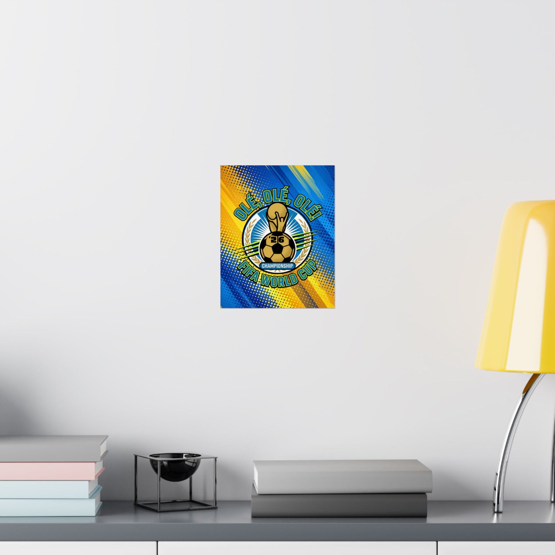 Decorative poster with a soccer ball design on a wall above a shelf with books and a lamp.