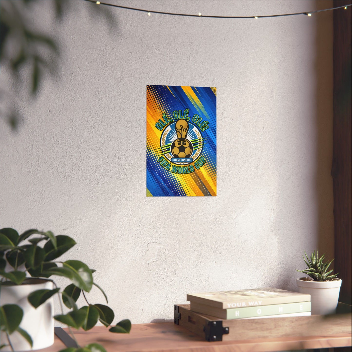 Colorful poster on a white wall with a wooden desk and plants below.