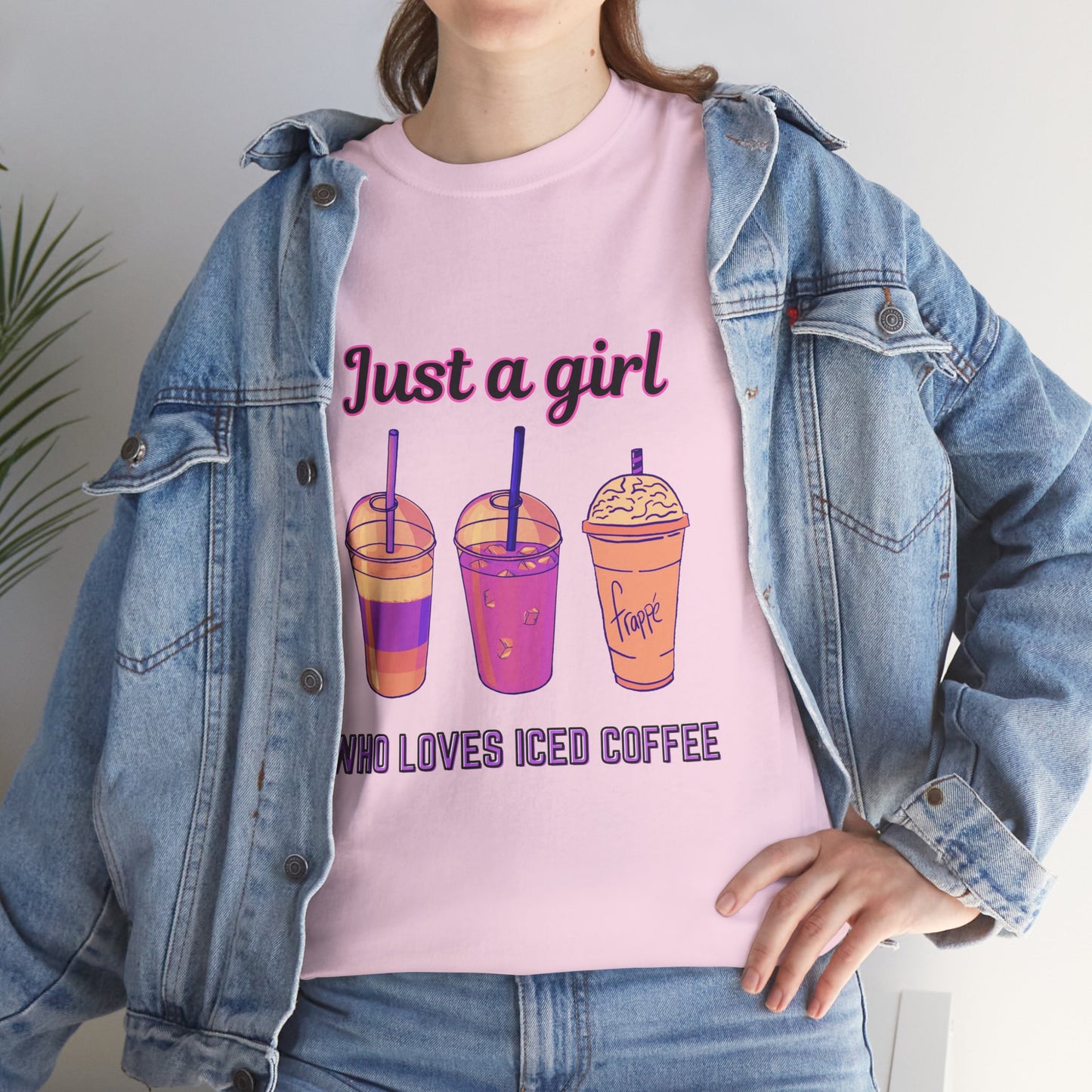 Coffee Lovers' Cotton Tee - Just a Girl Who Loves Iced Coffee, Person wearing a pink t-shirt with iced coffee graphics and text, paired with a denim jacket.