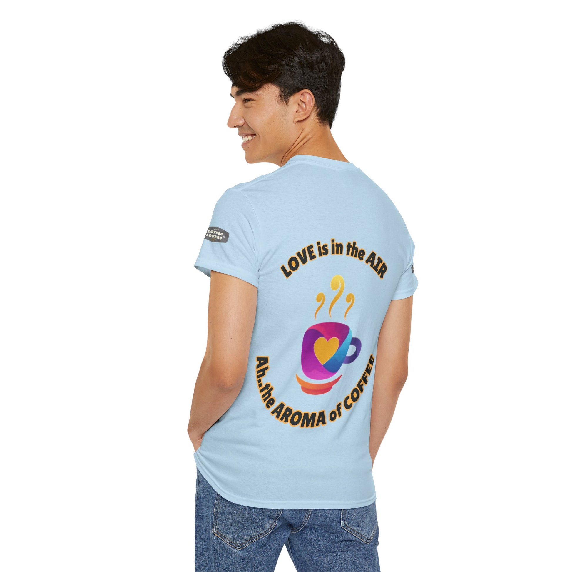 Coffee Lovers Tee with Quote - 'Love is in the Air Ah.. the Aroma of Coffee',  Person wearing a light blue t-shirt with text and graphics on the back, standing against a white background.