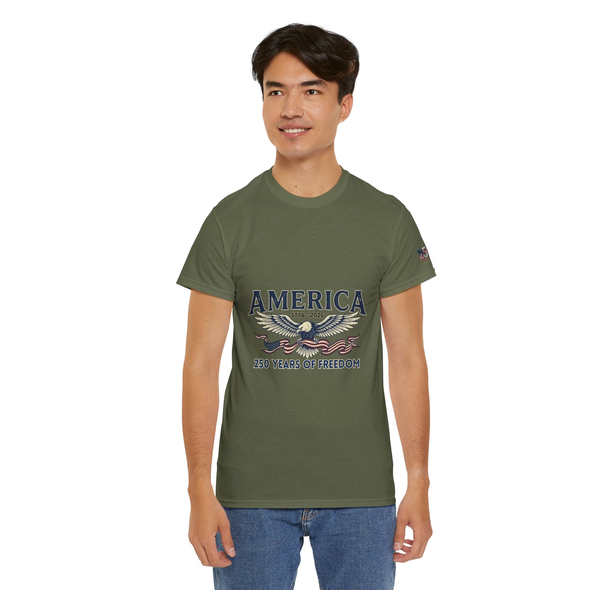 America 250 Years of Freedom T-Shirt — USA 250th ANNIVERSARY T-shirt, Person wearing a green t-shirt with 'America' and eagle design on a white background