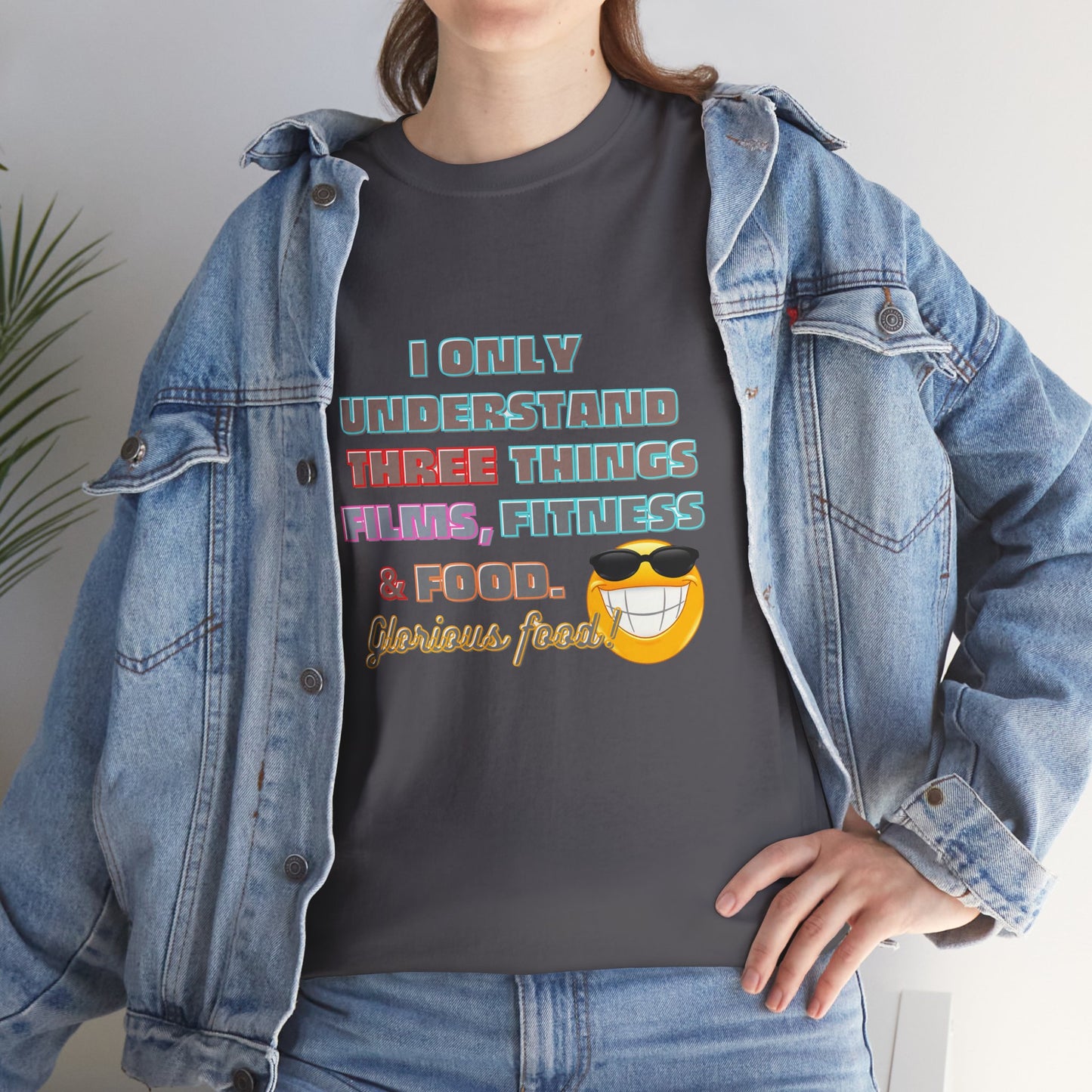 Gym fitness body building t-shirt, Funny Fitness Quotes Cotton T-shirt, Person wearing a dark gray t-shirt with colorful text and graphics, paired with a denim jacket.