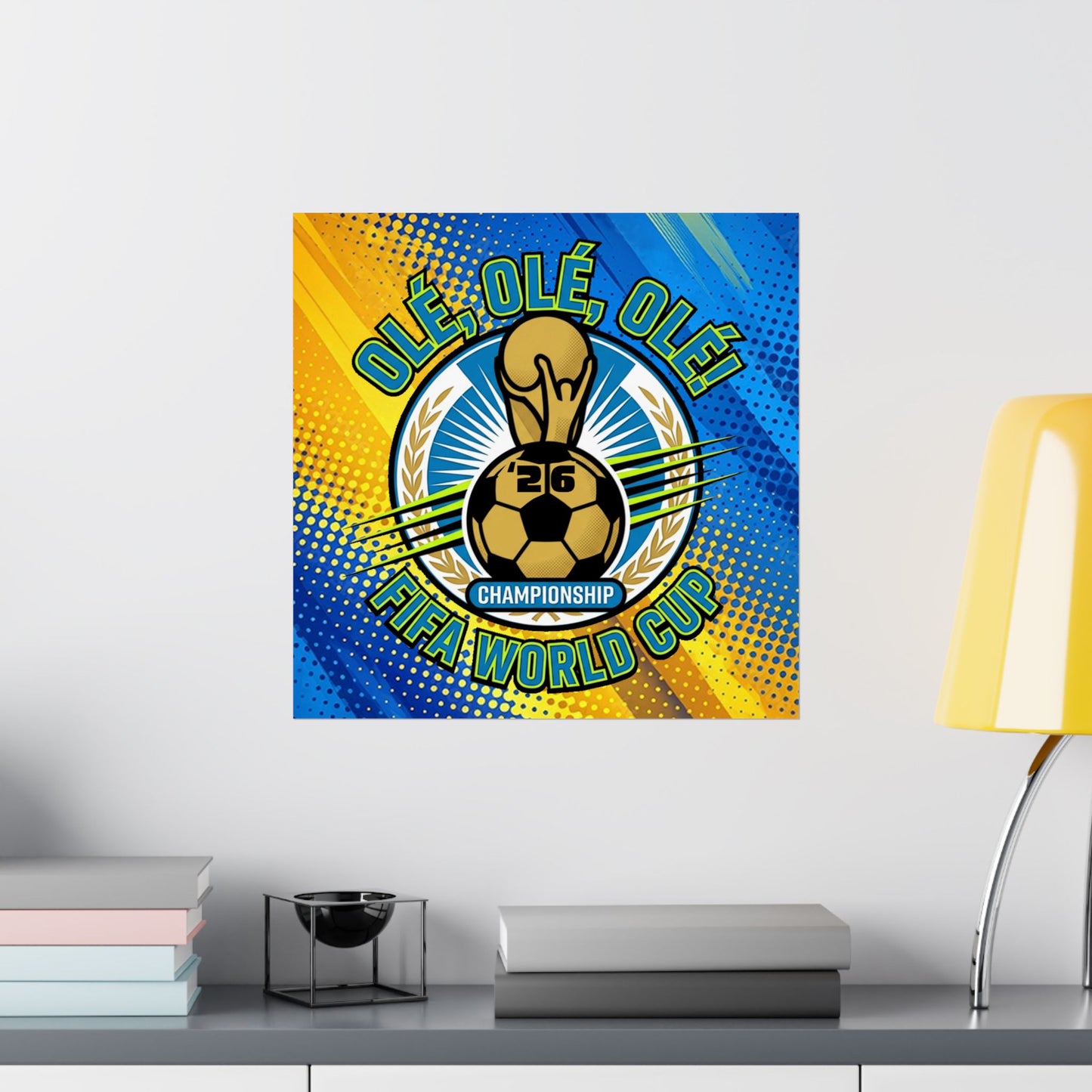 FIFA World Cup-themed decorative wall art on a white wall with a lamp and books in the foreground.