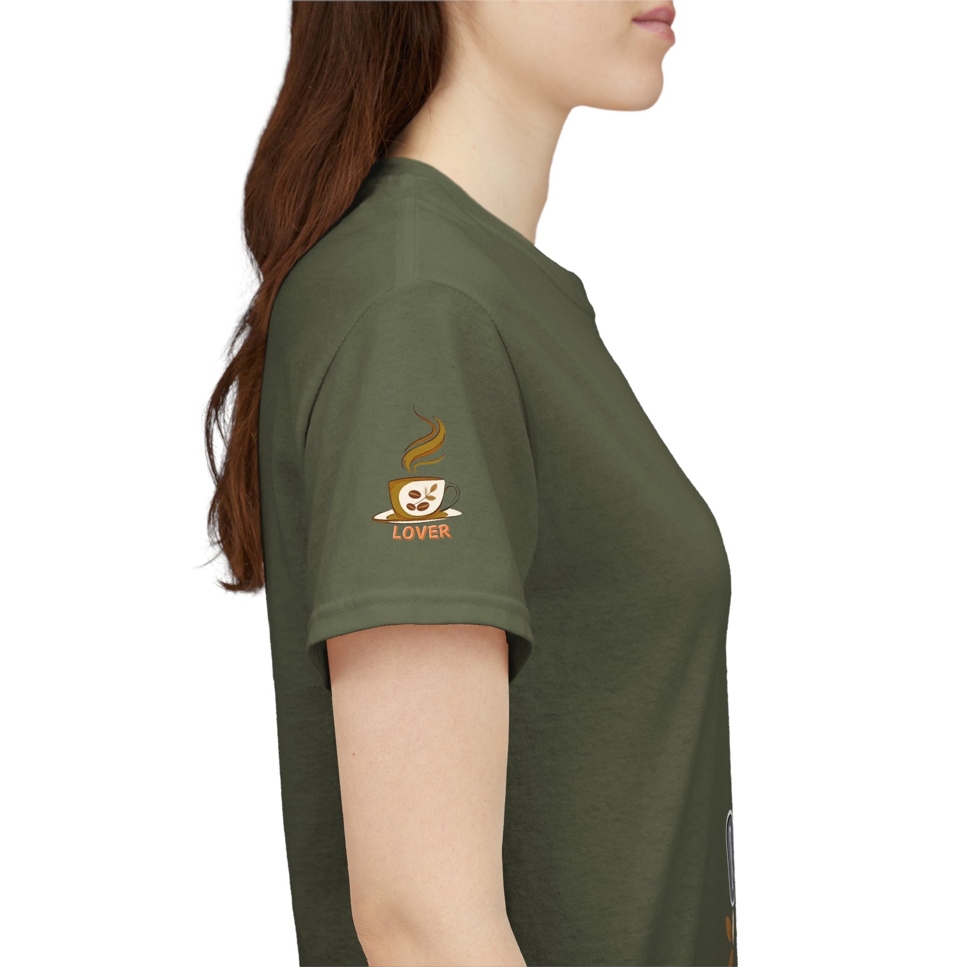 Coffee Lover's Heavy Cotton Unisex T-shirt, Person wearing a green t-shirt with a coffee-themed graphic on the sleeve.