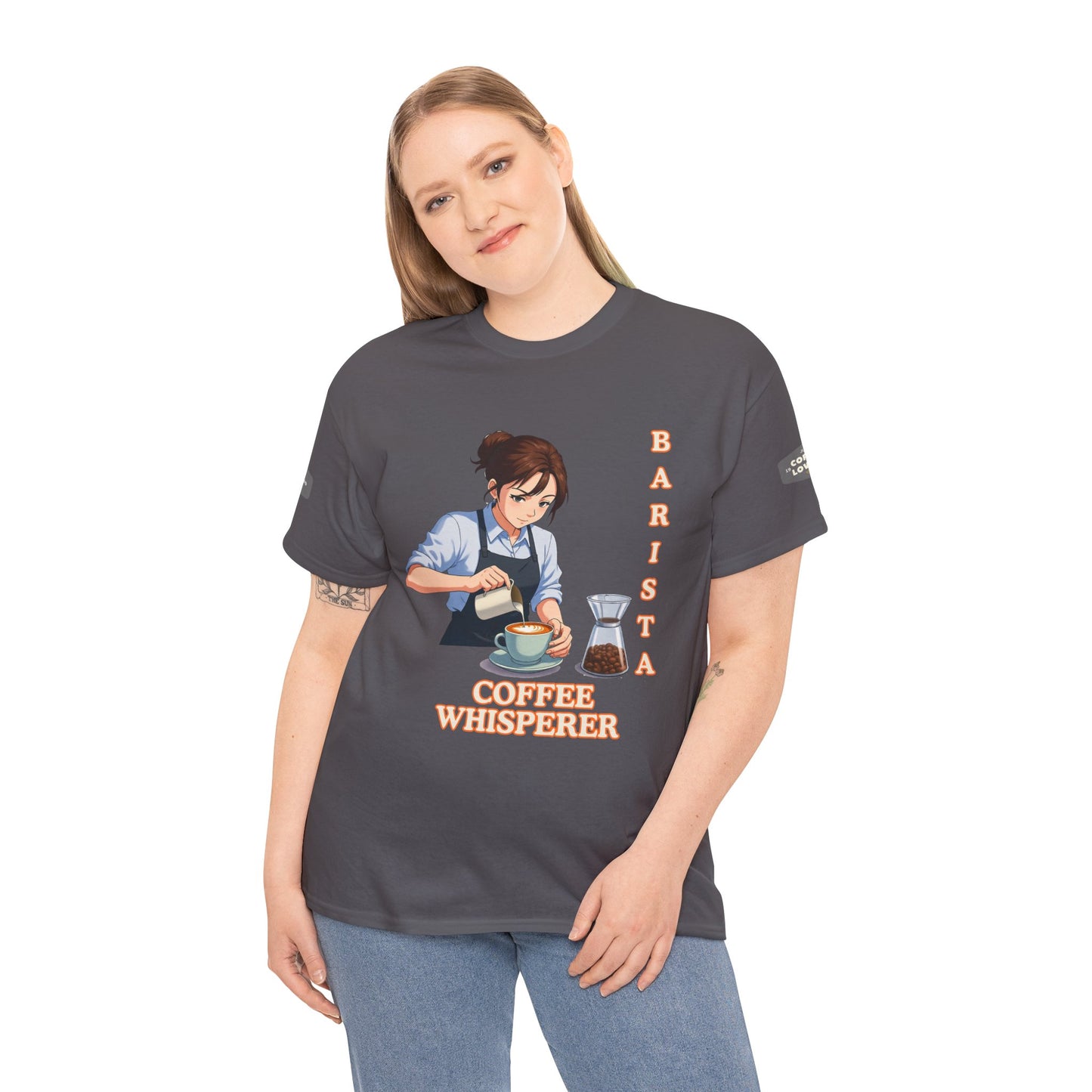 Coffee Lovers Cotton Tee for Female Barista, Person wearing a dark gray t-shirt with a graphic of a barista and text 'Coffee Whisperer' on a white background.