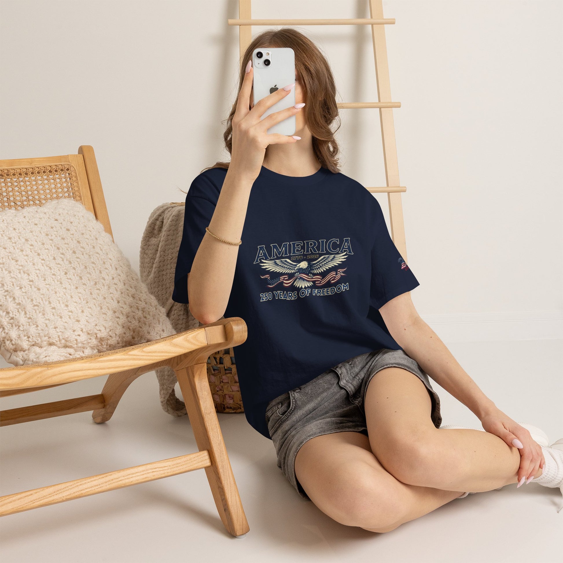 America 250 Years of Freedom T-Shirt — USA 250th ANNIVERSARY T-shirt, Person wearing a black t-shirt with 'BOYFRIEND BEATER' text, sitting on the floor.