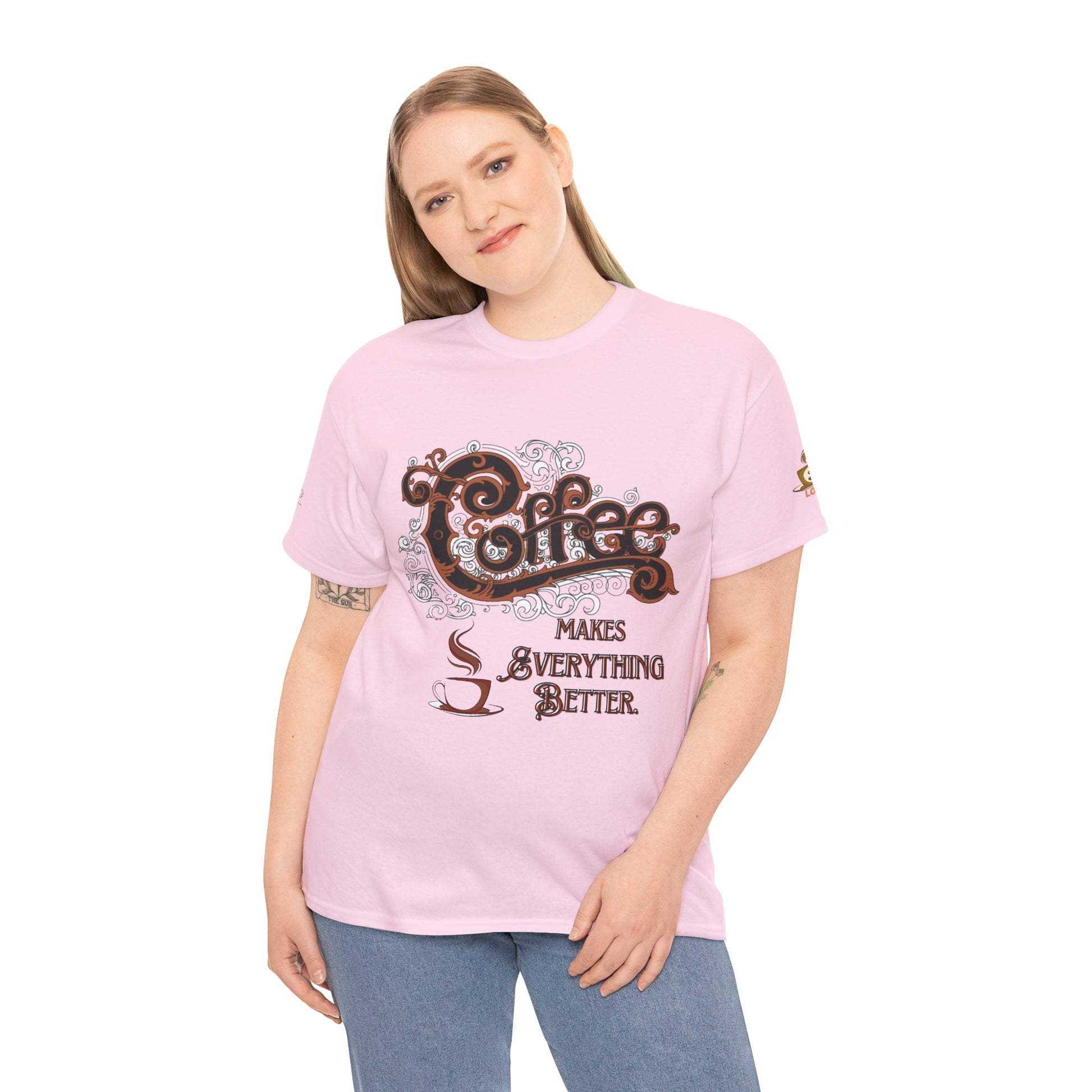 COFFEE LOVERS Cotton Tee - Coffee Makes Everything Better, Person wearing a pink t-shirt with a coffee-themed design on a white background