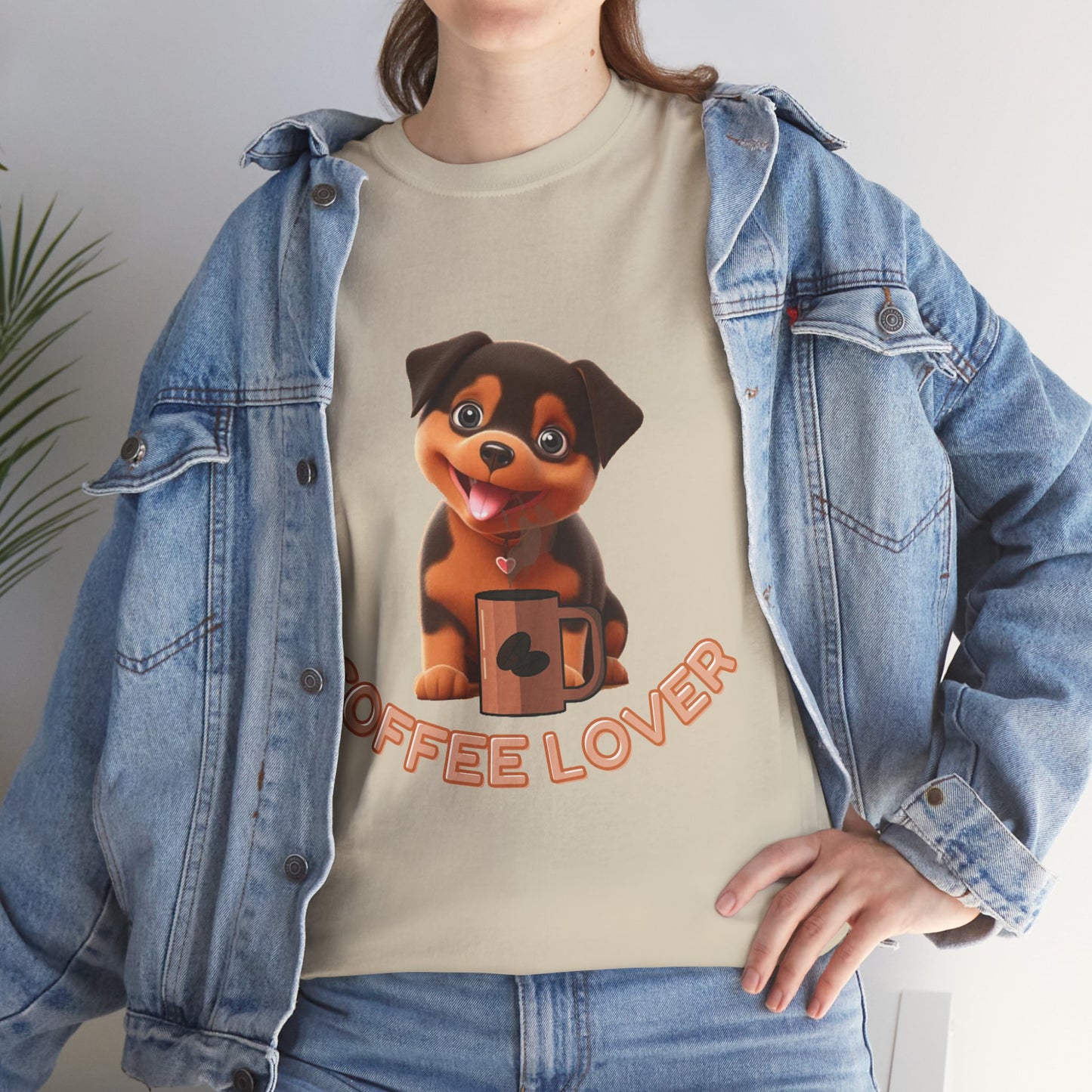 COFFEE LOVERS COTTON TEE for Dog Lovers. Person wearing a beige t-shirt with a dog graphic and 'Coffee Lover' text, paired with a denim jacket.
