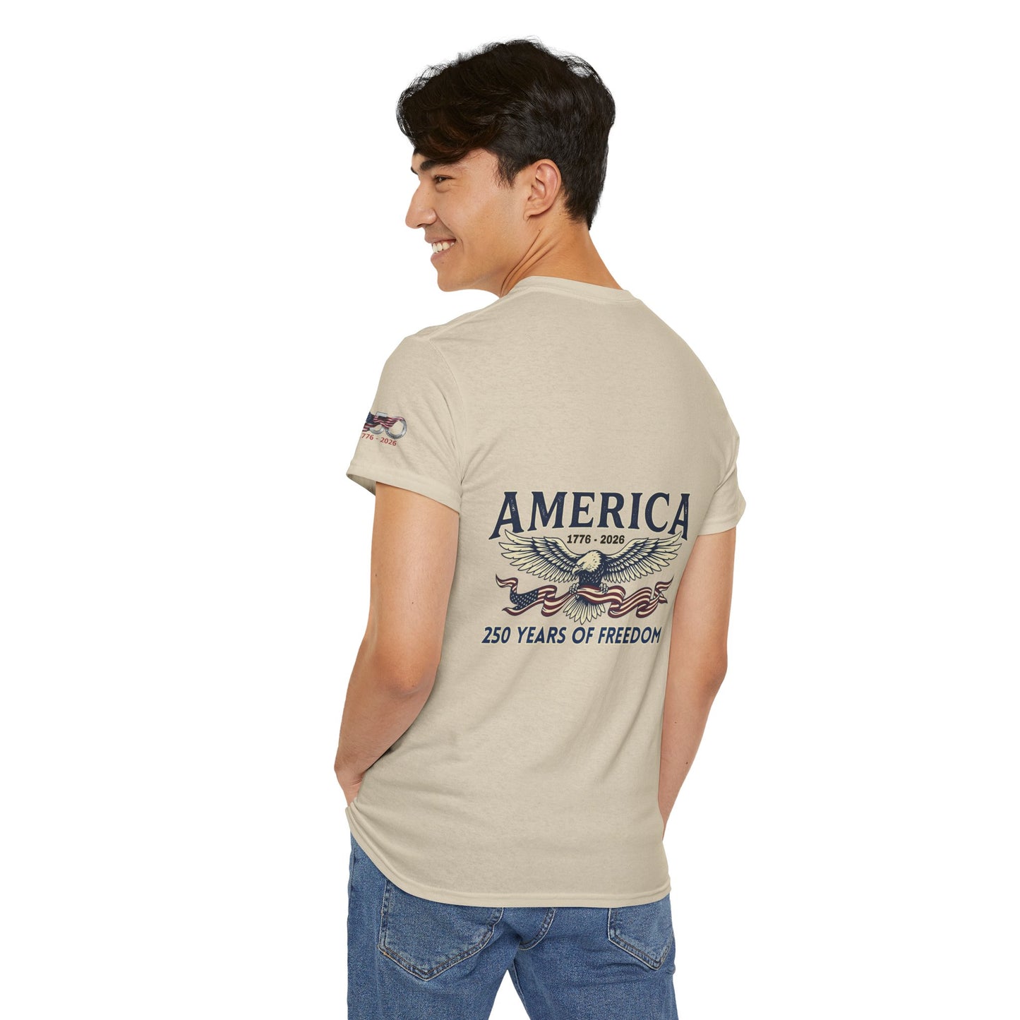 America 250 Years of Freedom T-Shirt — USA 250th ANNIVERSARY T-shirt, Man wearing a beige t-shirt with 'America' and eagle design on a white background