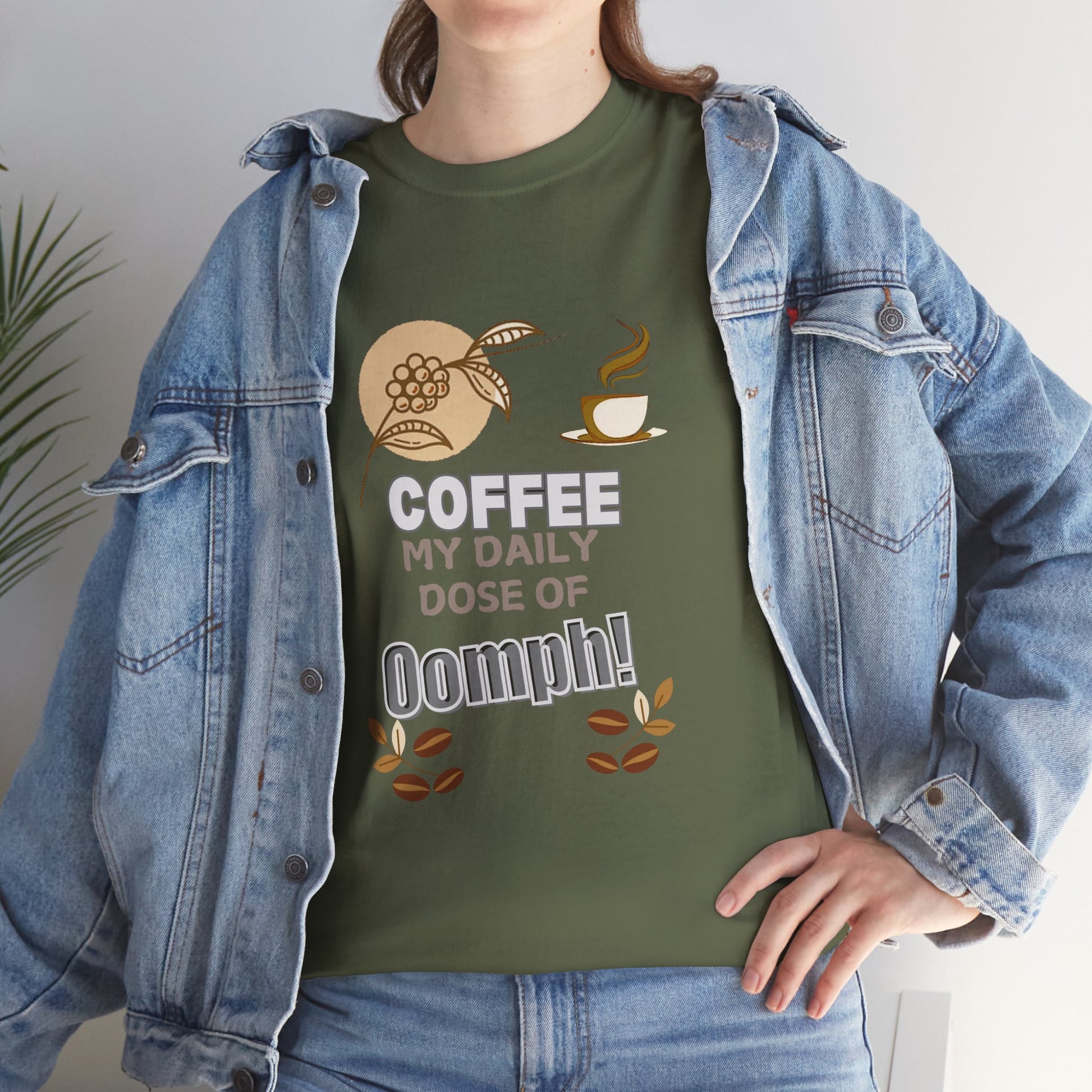 Person wearing a green t-shirt with a coffee-themed design and denim jacket.