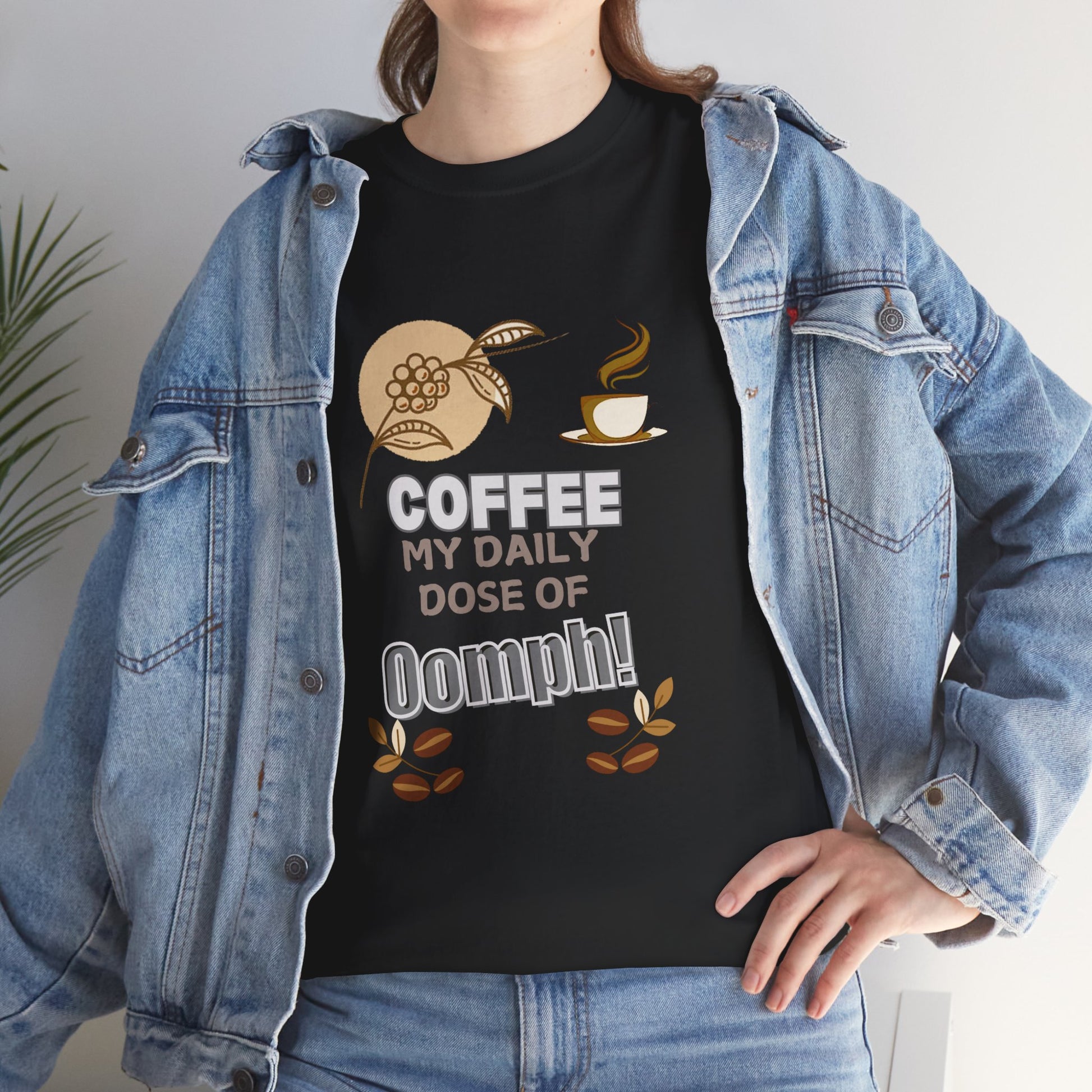 Coffee Lovers Heavy Cotton Tee - My Daily Dose of Oomph! Person wearing a black t-shirt with coffee-themed design and denim jacket.