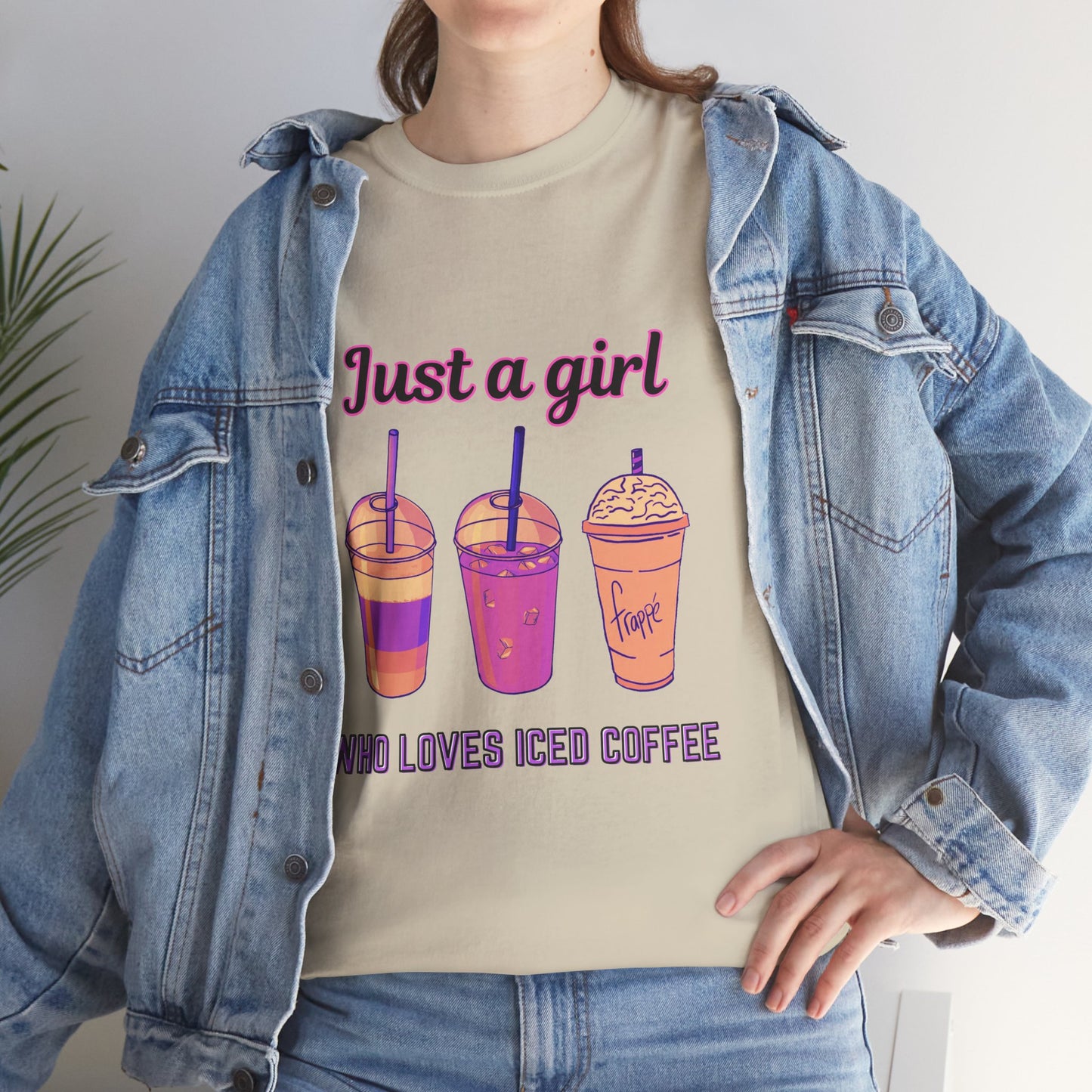 Coffee Lovers' Cotton Tee - Just a Girl Who Loves Iced Coffee, Person wearing a beige t-shirt with colorful drink graphics and text, paired with a denim jacket.